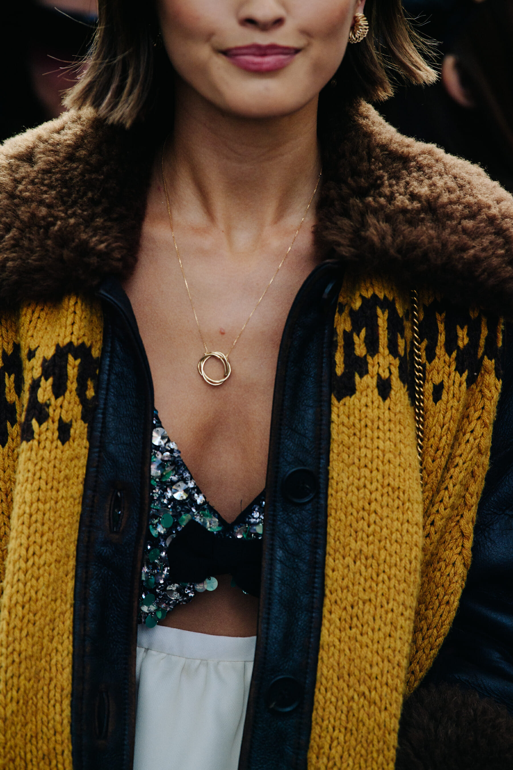Woman wearing rin necklace