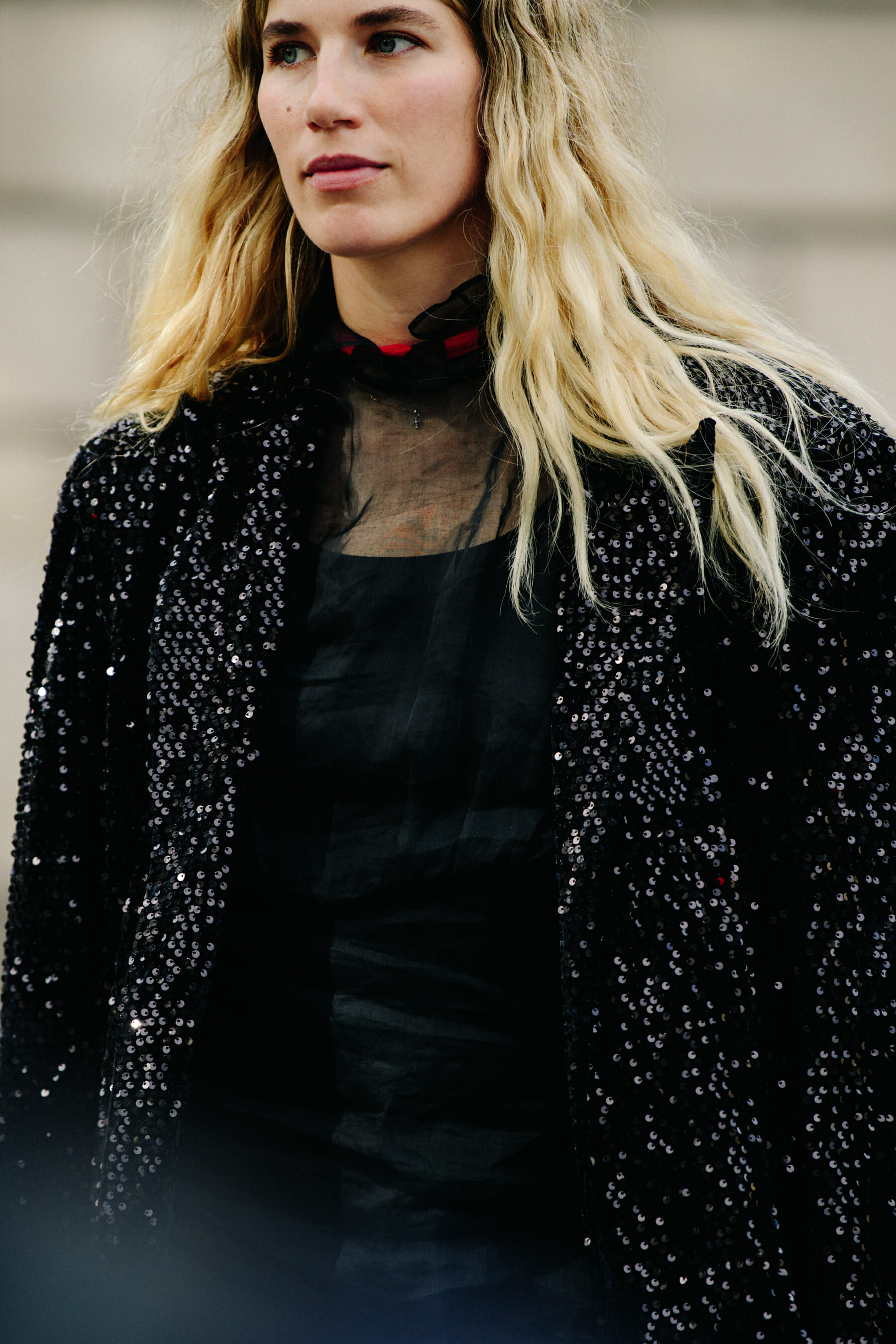 Woman wearing sequin jacket