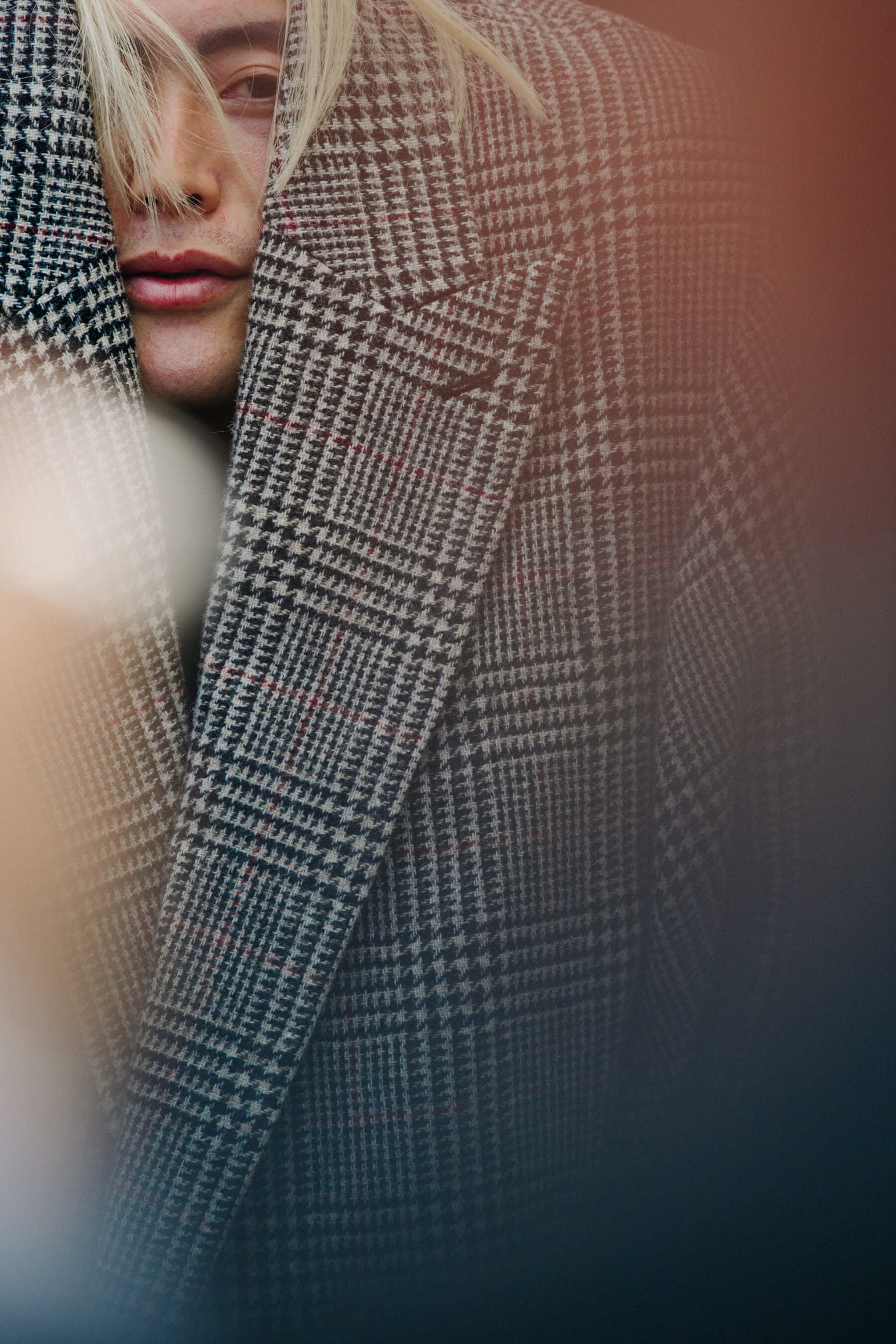 Man wearing oversized check coat