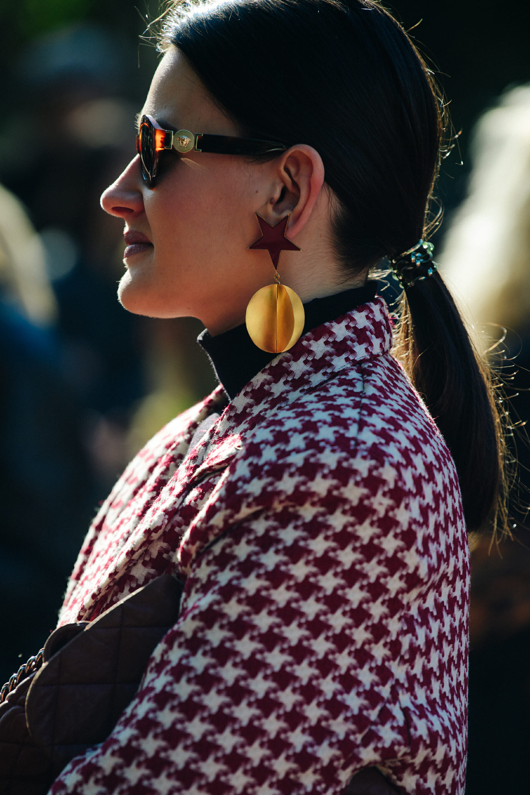 Woman wearing gold earring