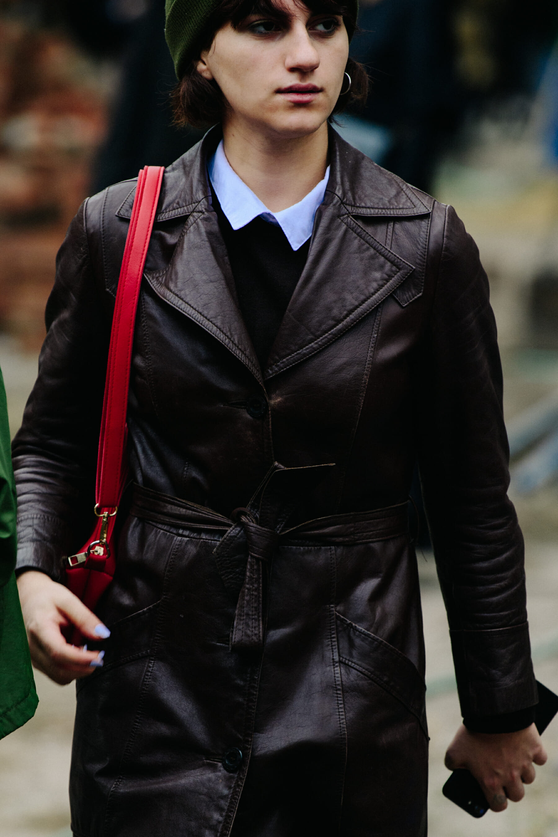 Woman wearing brown leather coat