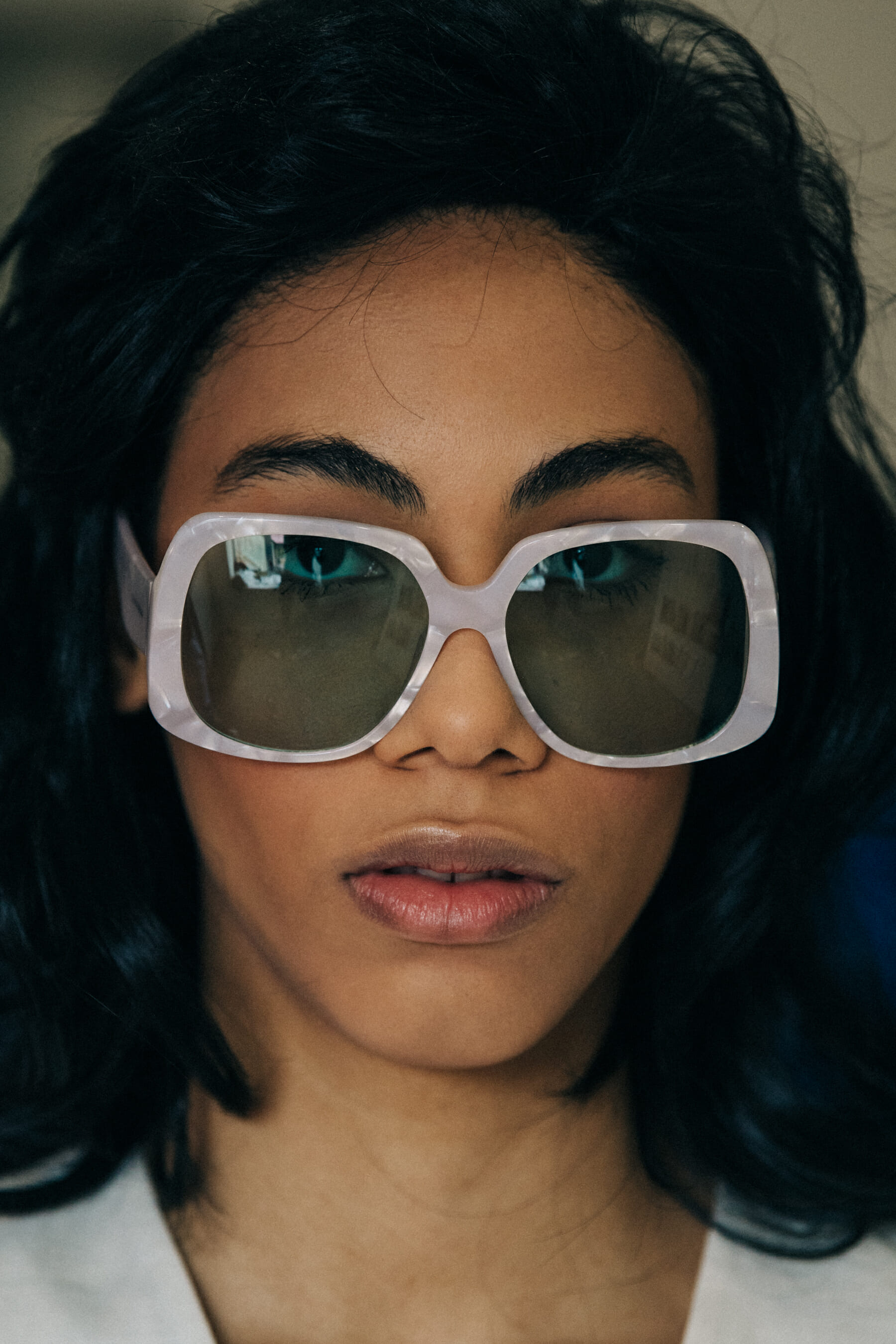 Model wearing wig and sunglasses