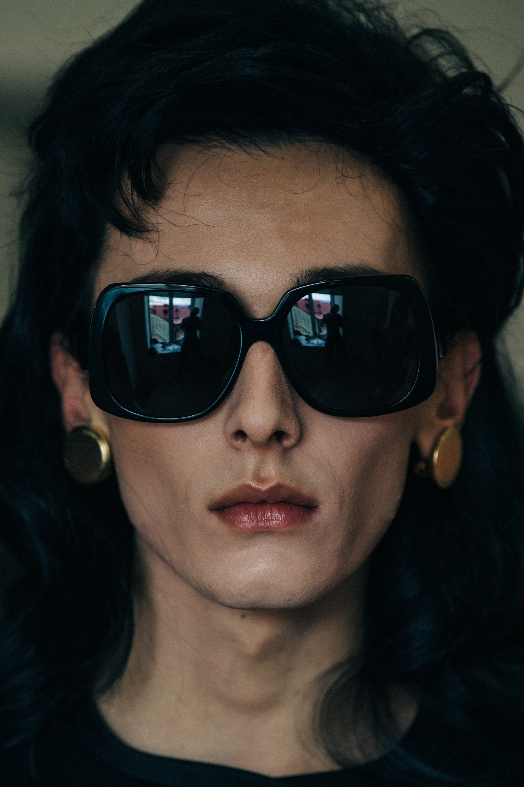 Model wearing wig and sunglasses