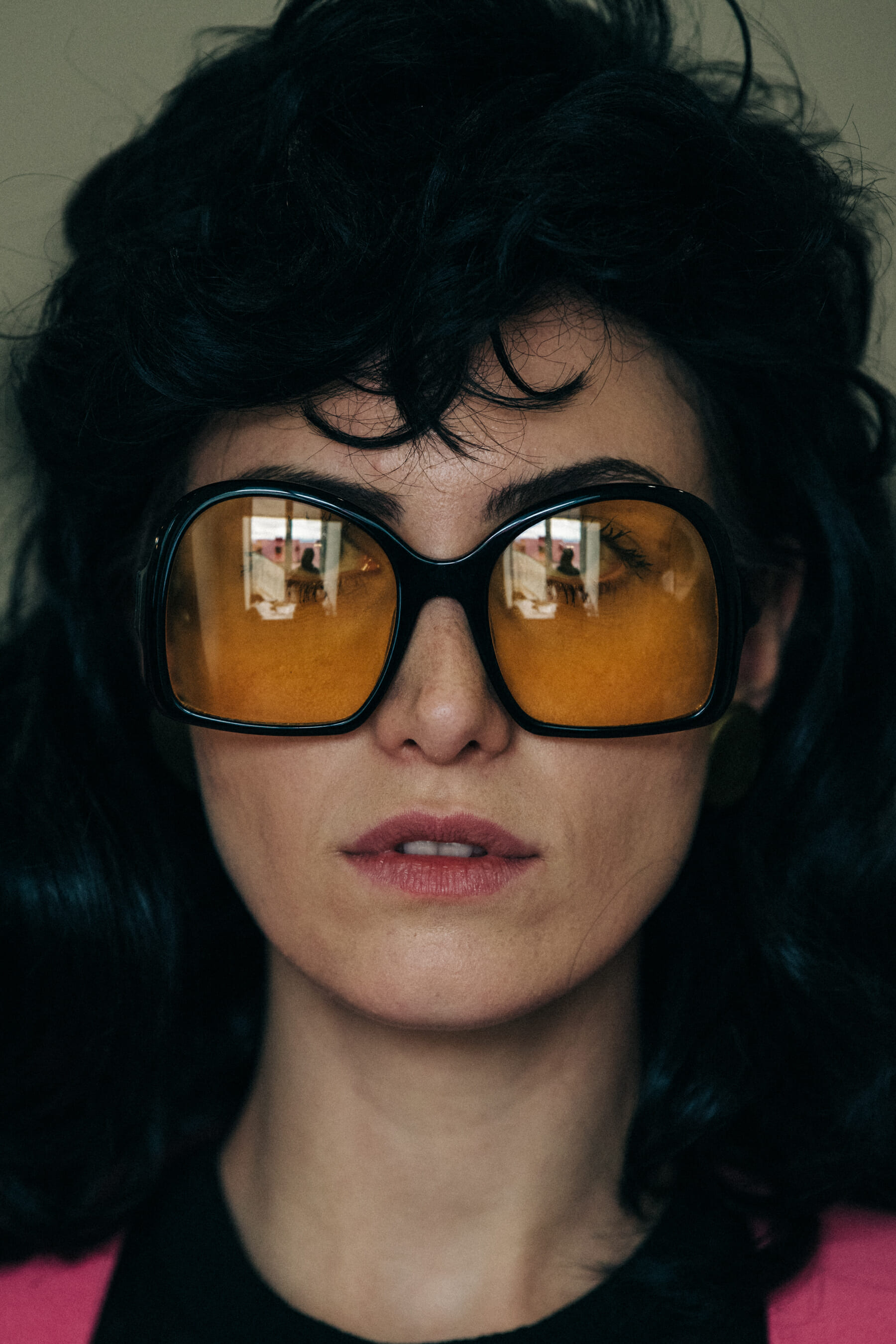 Model wearing wig and sunglasses