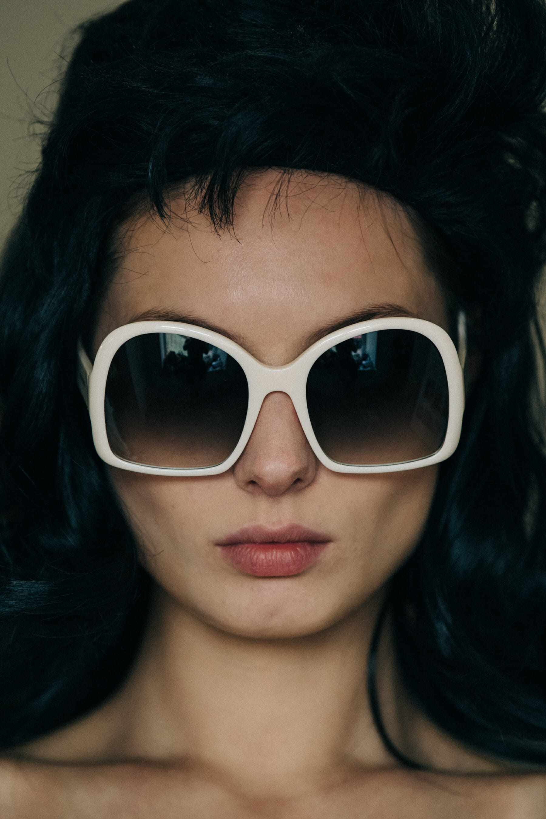Model wearing wig and sunglasses