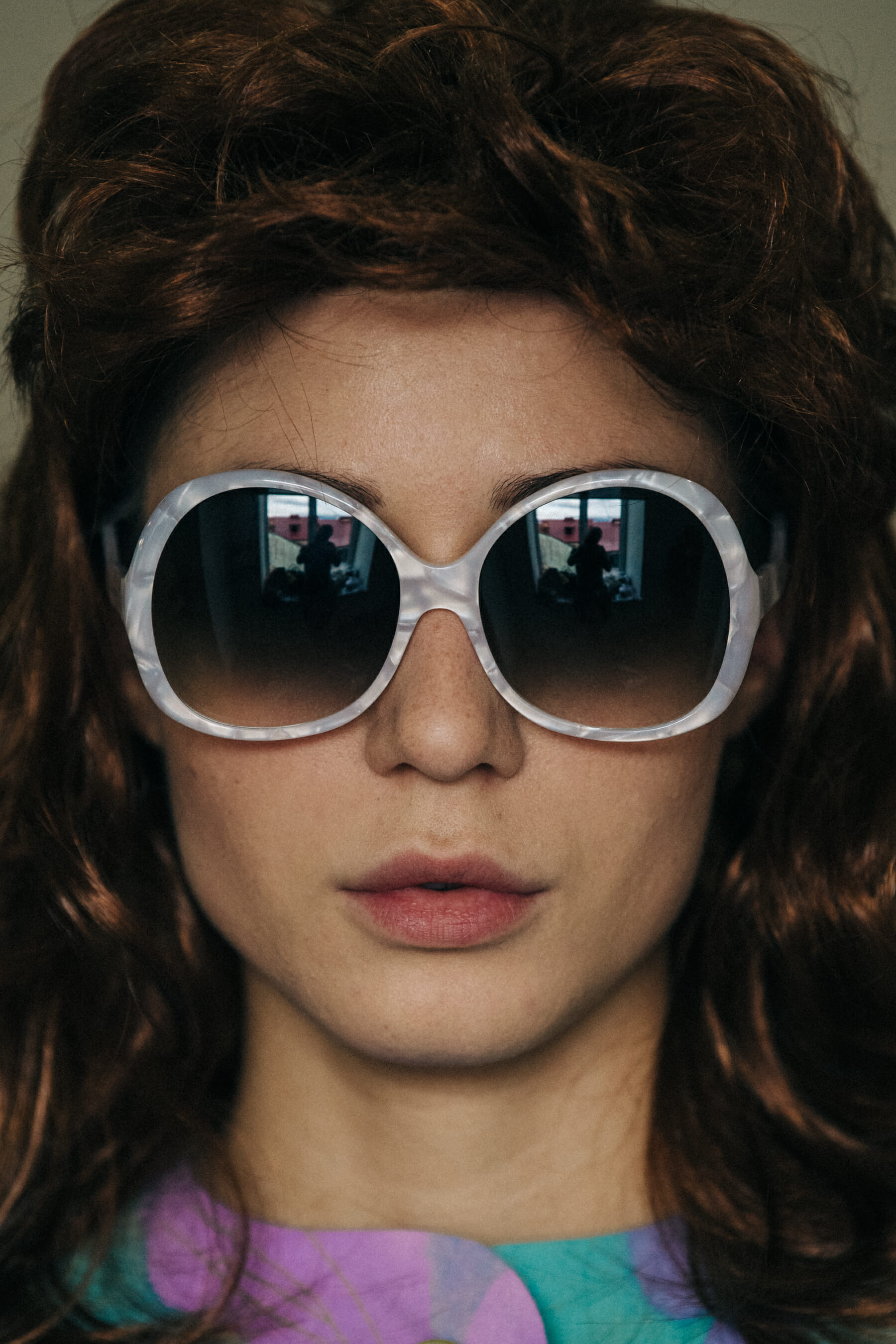 Model wearing wig and sunglasses