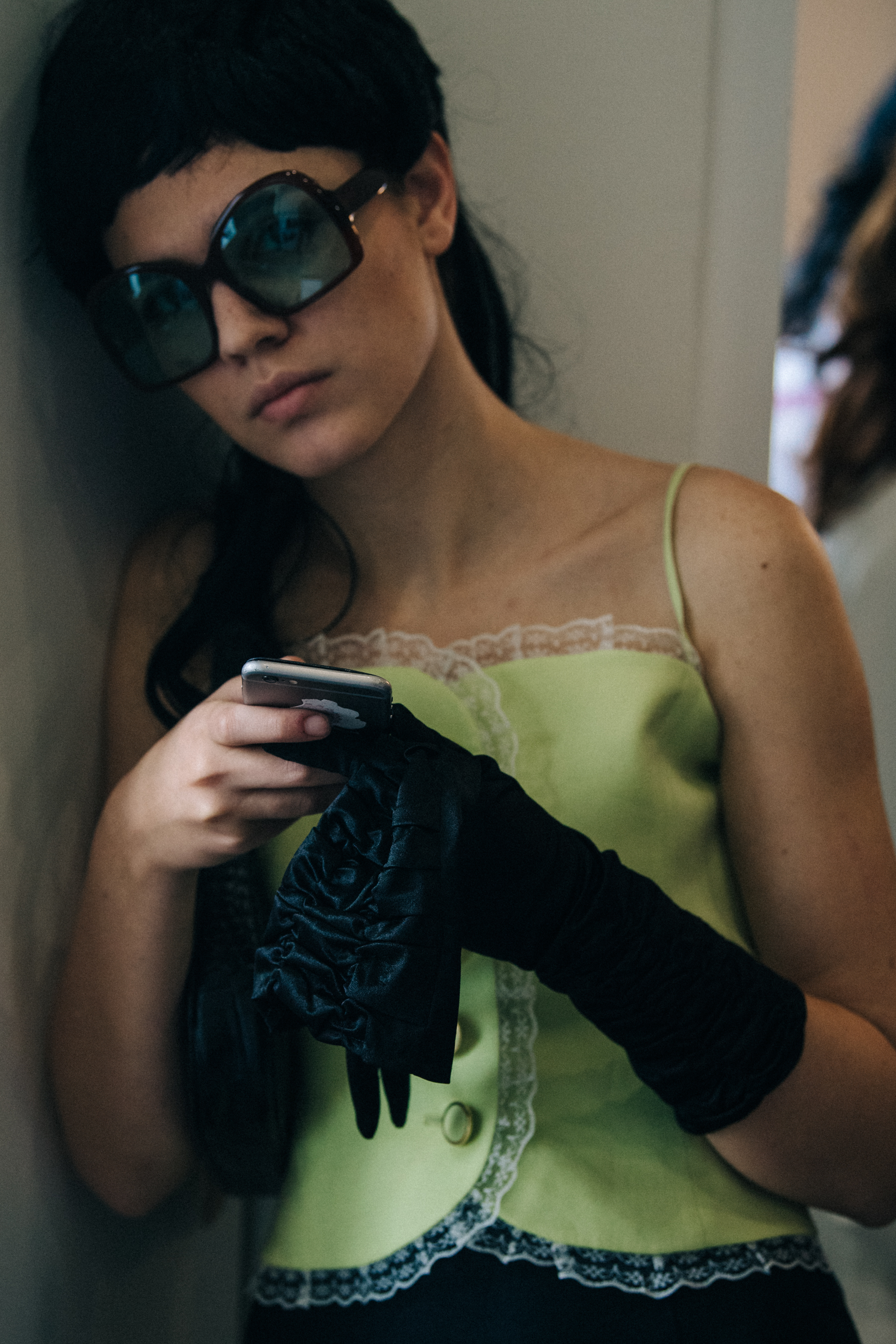 Model wearing wig and sunglasses