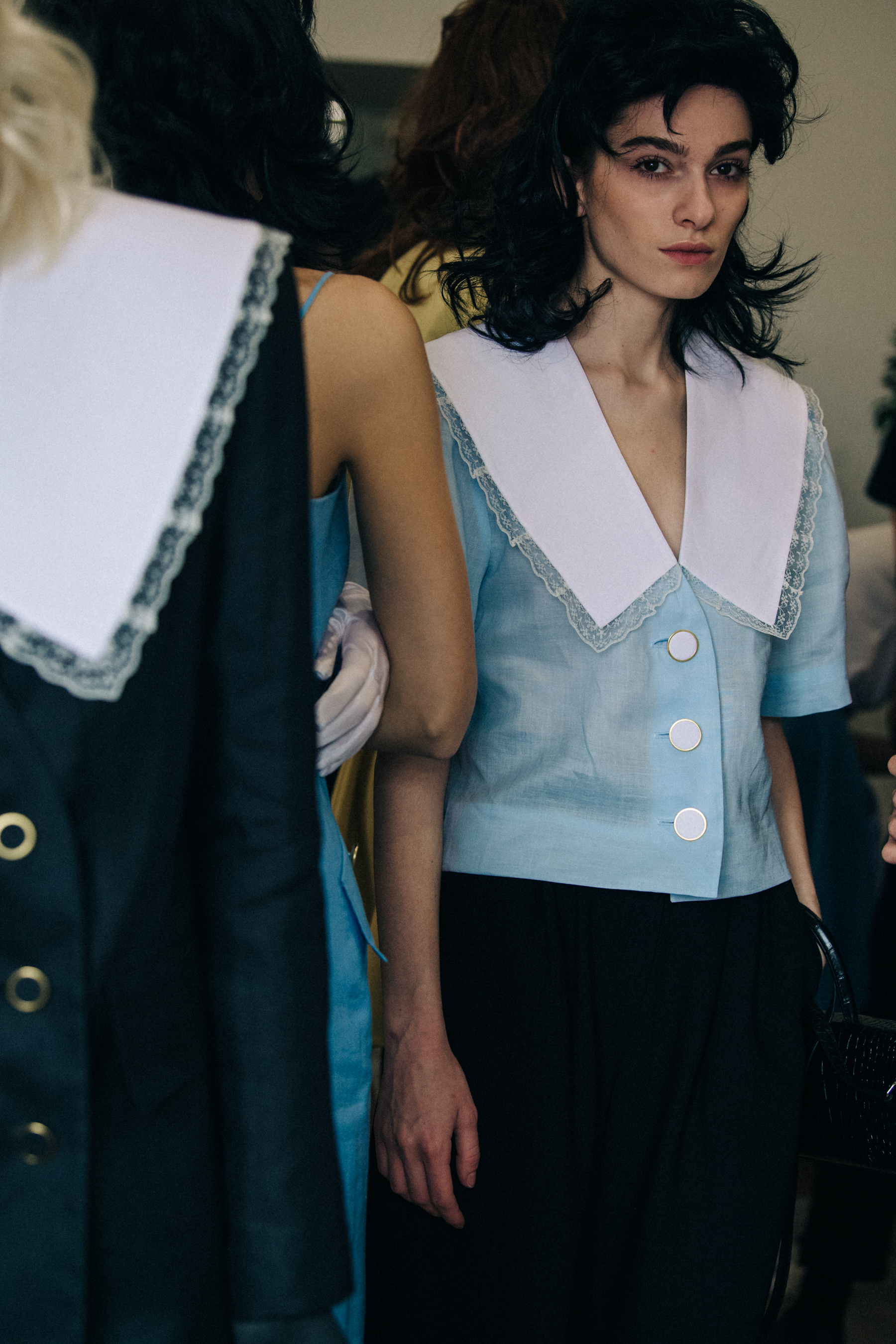 Model wearing blue backstage