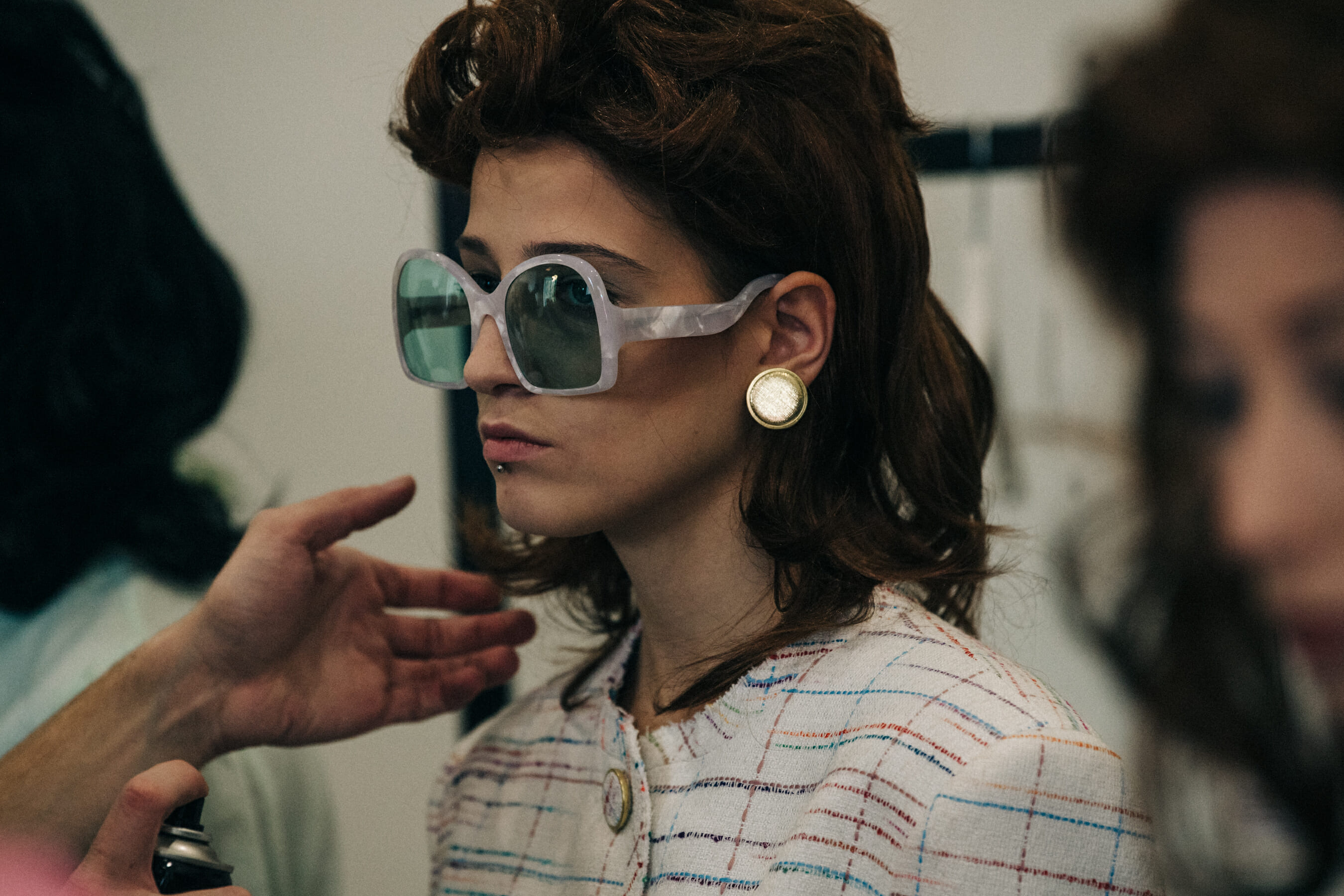 Model wearing wig and sunglasses