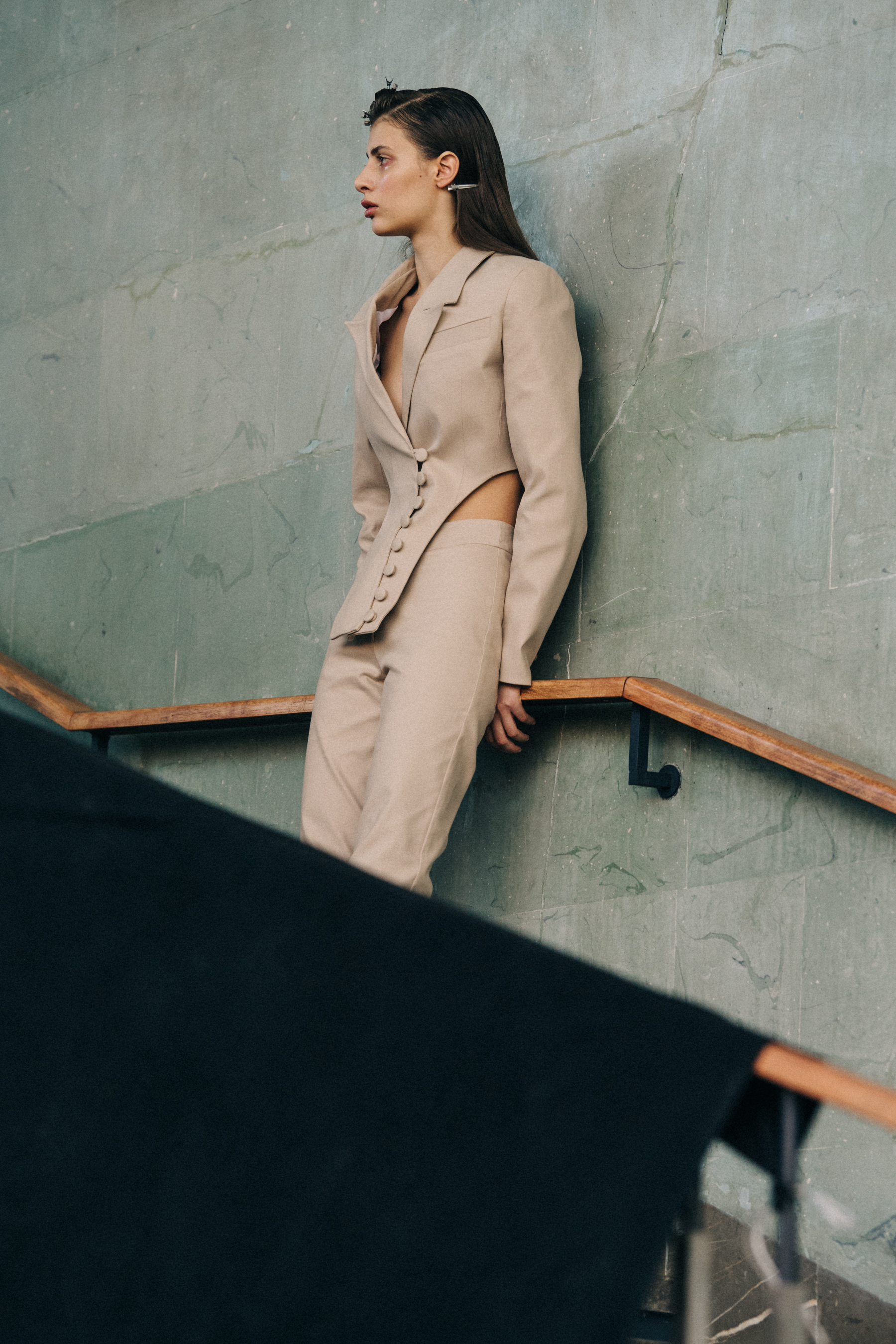 Model wearing tan suit
