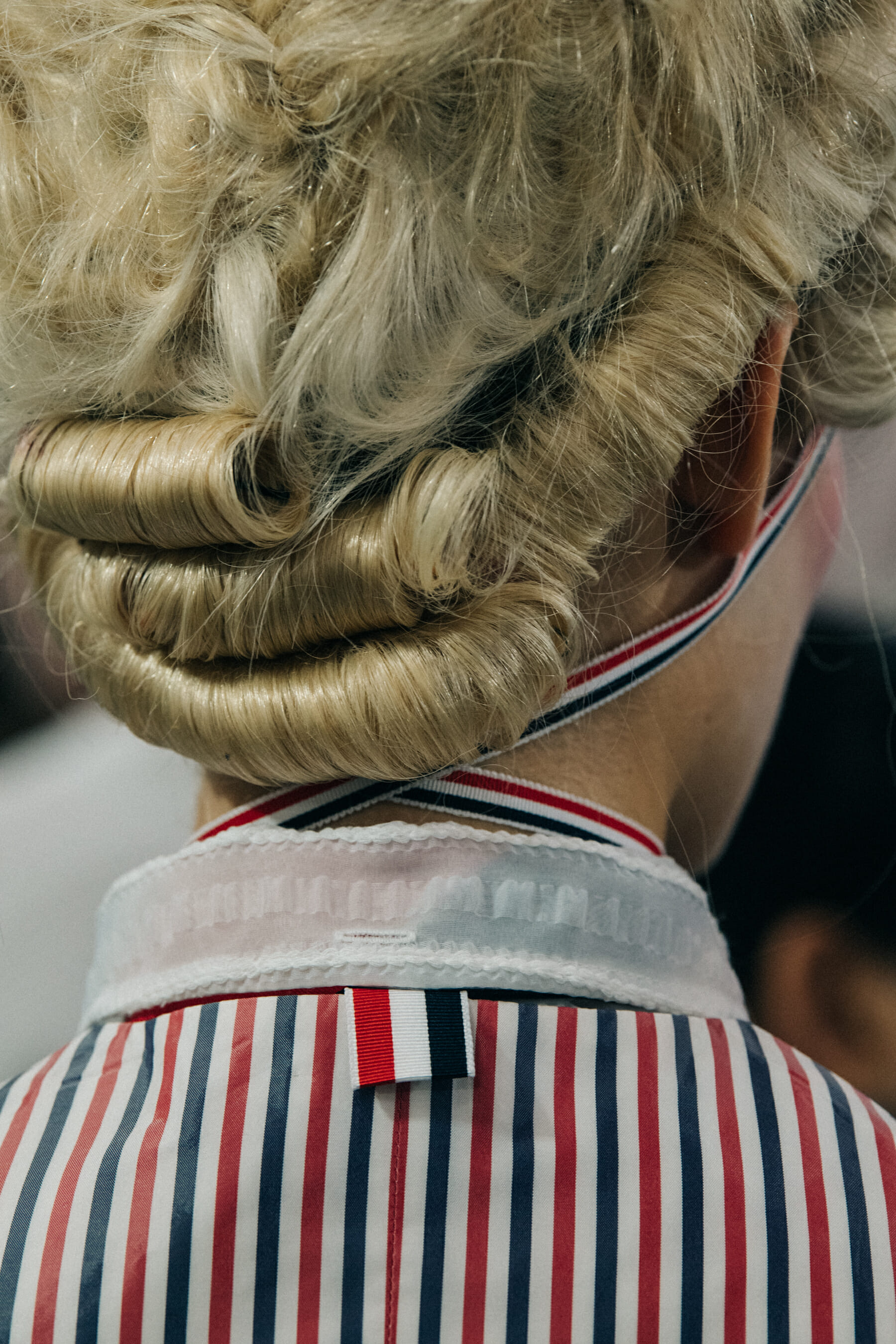 Models wearing tall wigs at Thom Browne