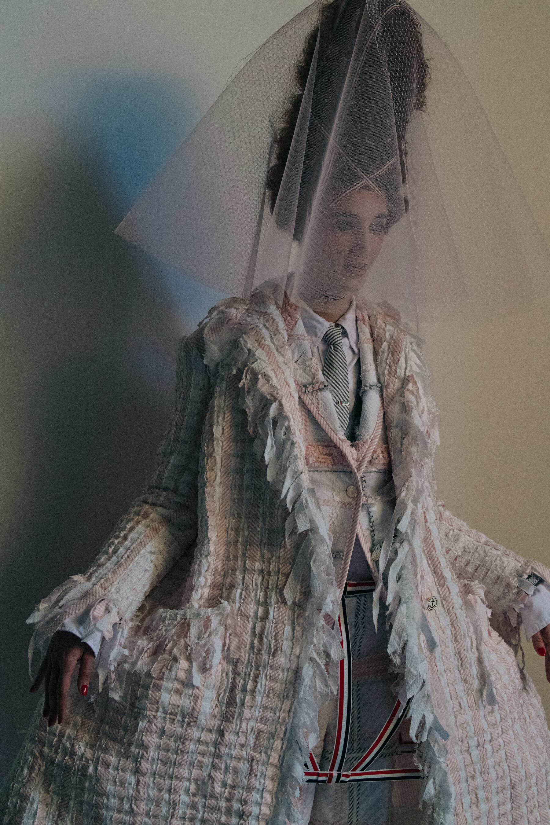 Models wearing tall wigs at Thom Browne