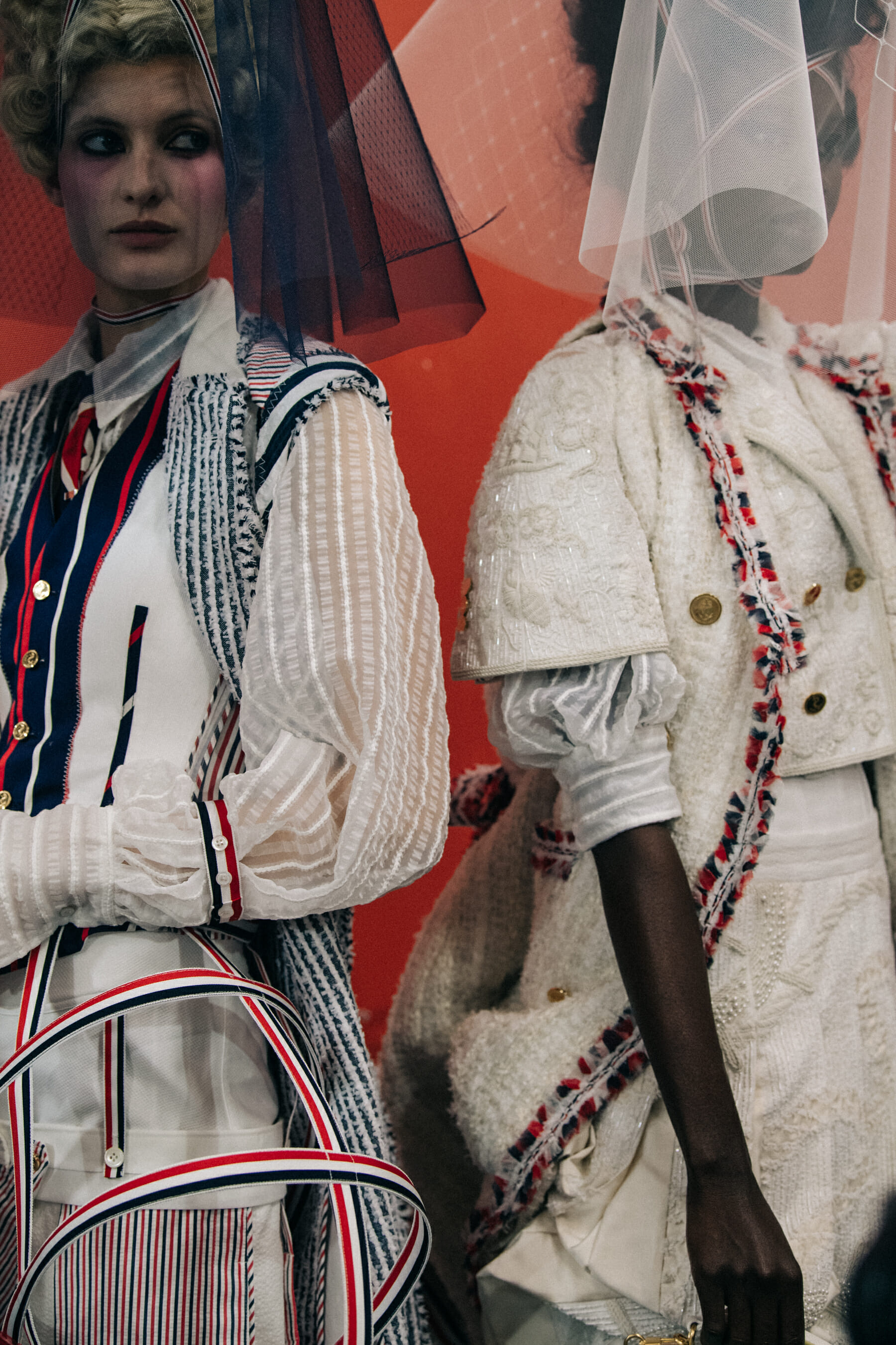 Models wearing tall wigs at Thom Browne