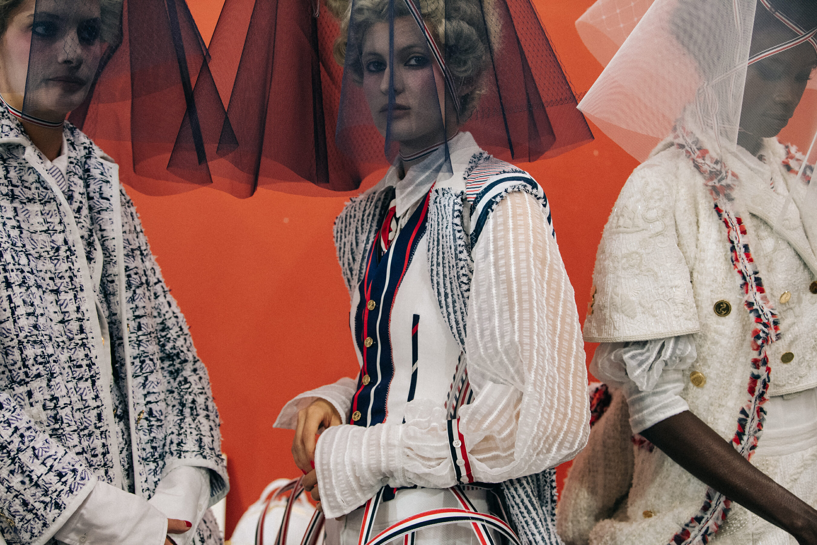 Models wearing tall wigs at Thom Browne