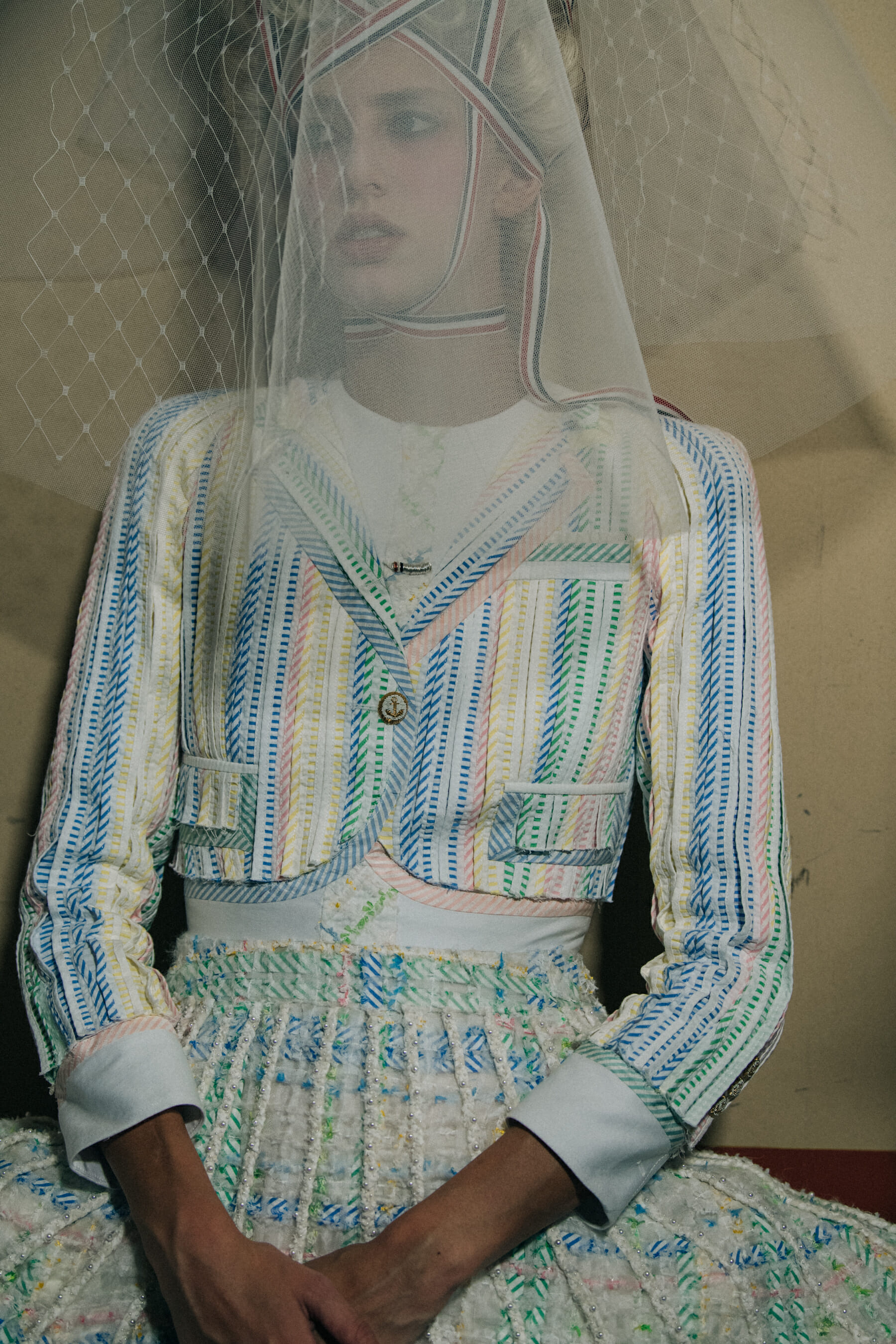 Models wearing tall wigs at Thom Browne
