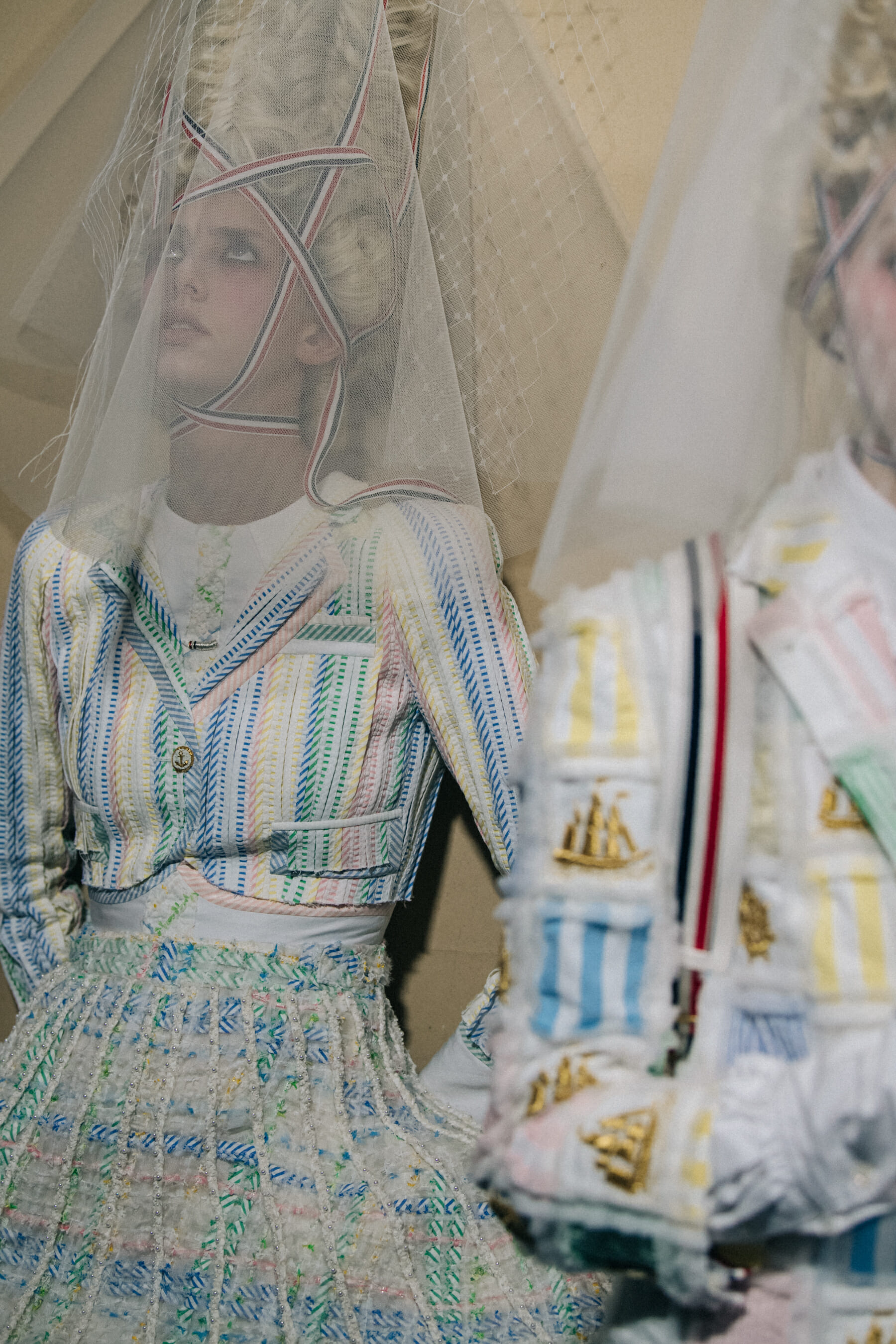 Models wearing tall wigs at Thom Browne