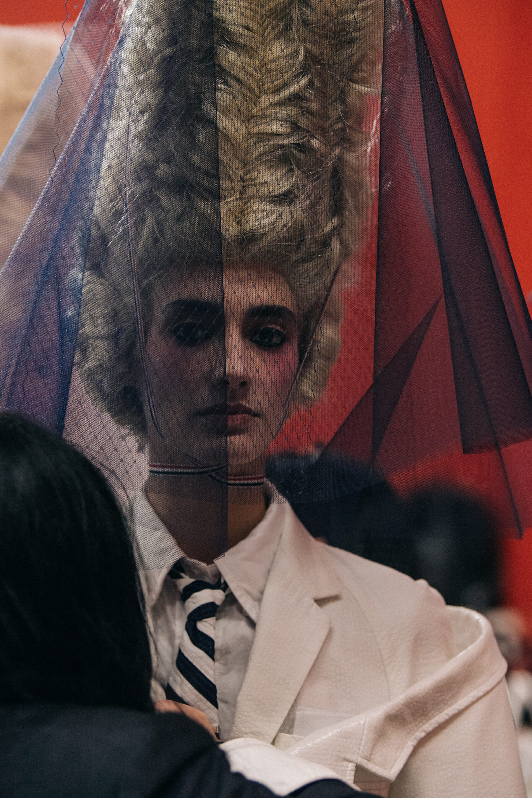 Models wearing tall wigs at Thom Browne