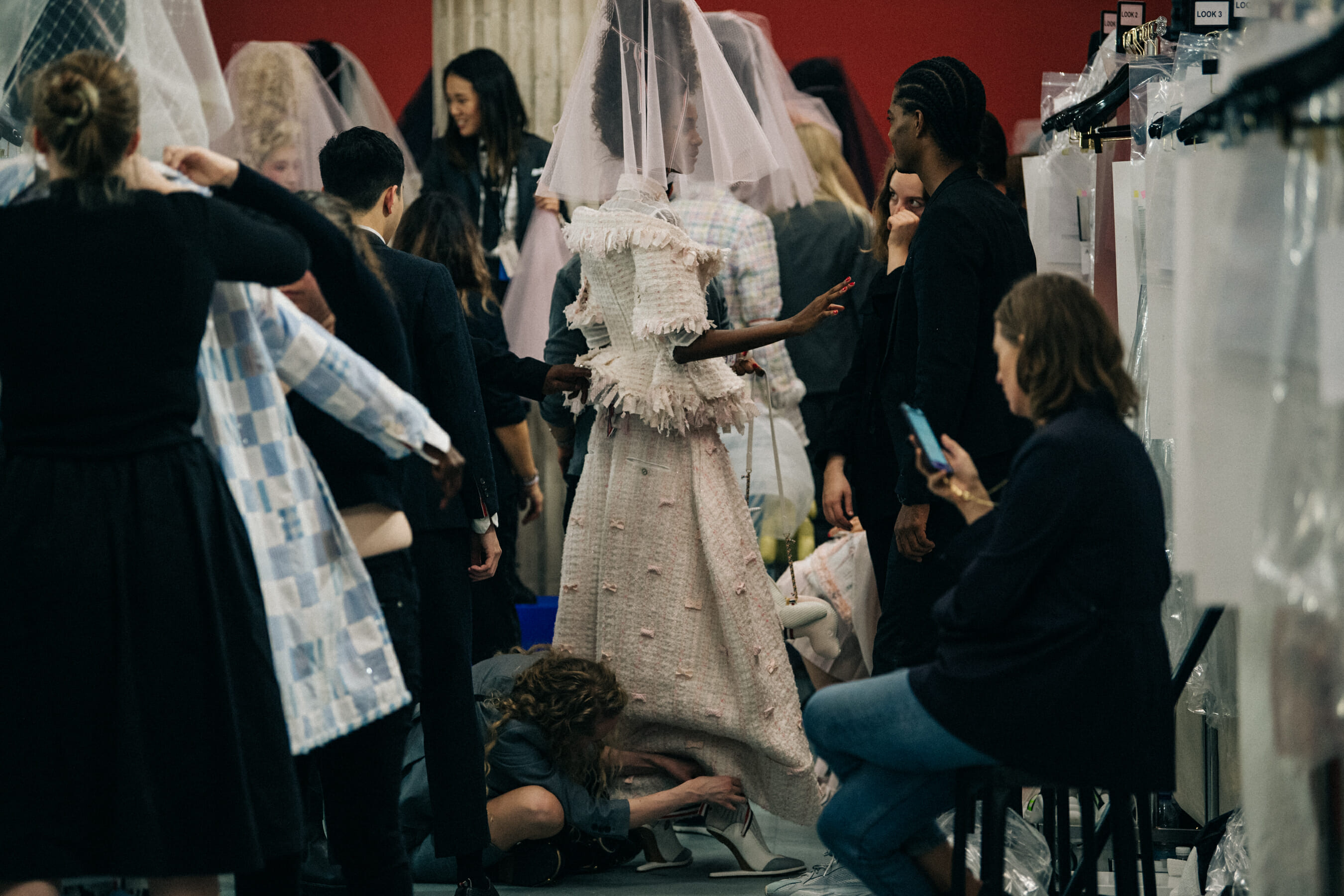 Models wearing tall wigs at Thom Browne