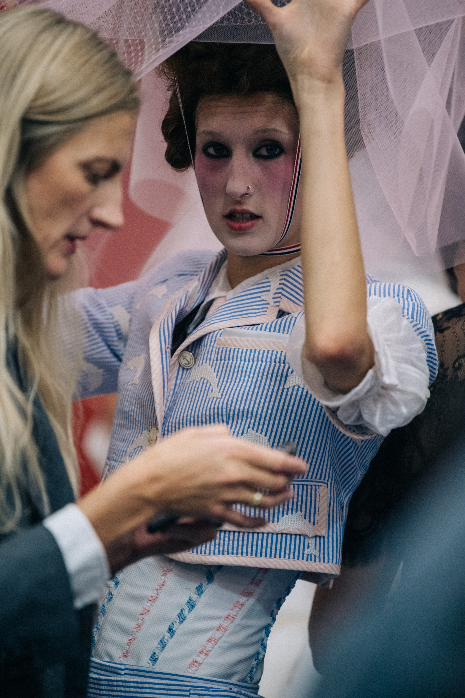 Models wearing tall wigs at Thom Browne
