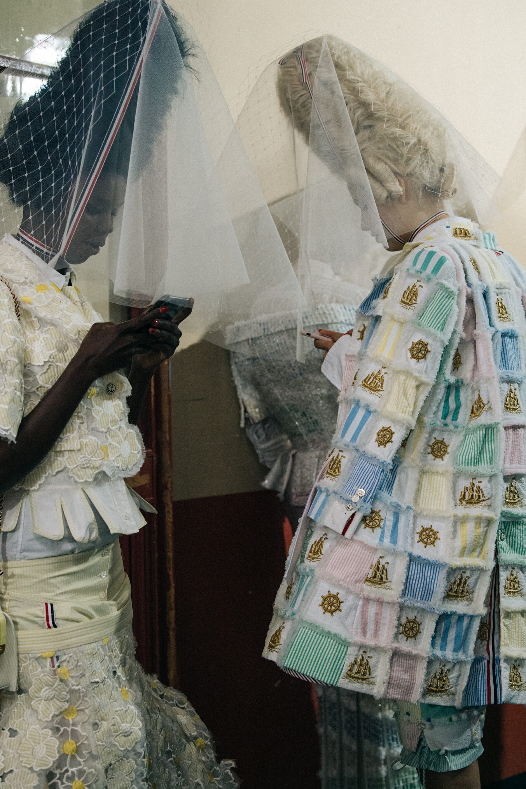Models wearing tall wigs at Thom Browne