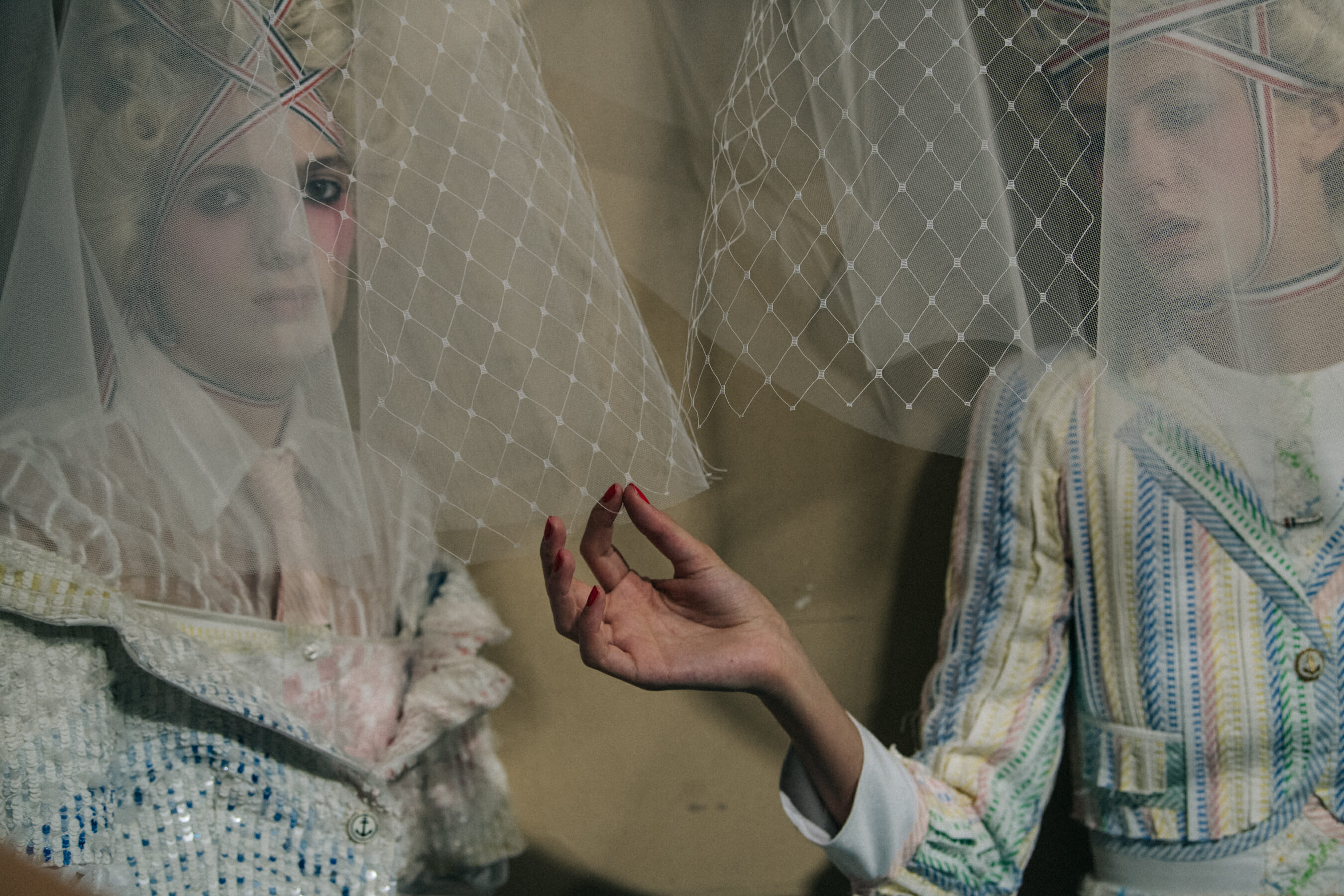 Models wearing tall wigs at Thom Browne