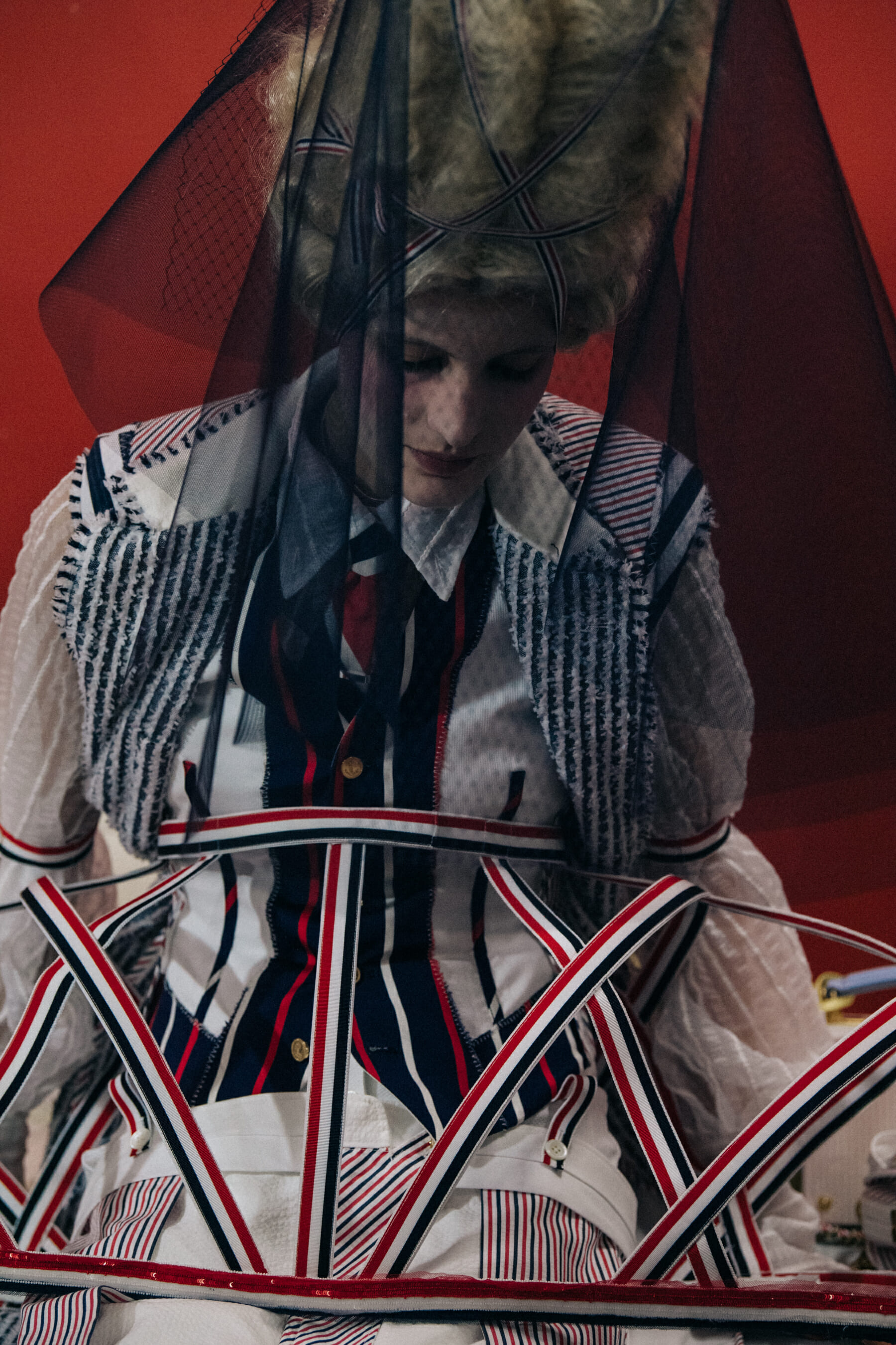 Models wearing tall wigs at Thom Browne