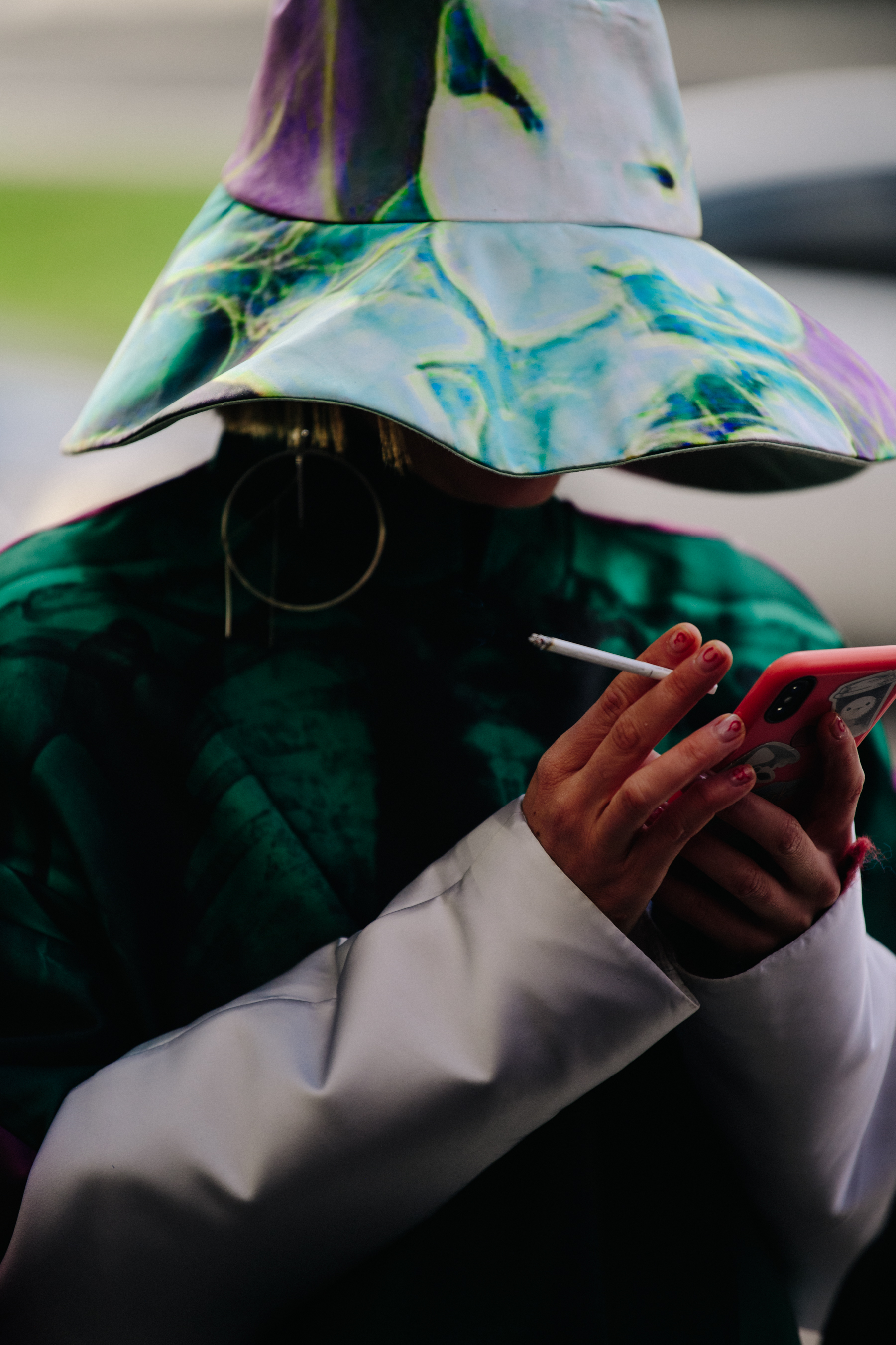 Woman wearing large green hat