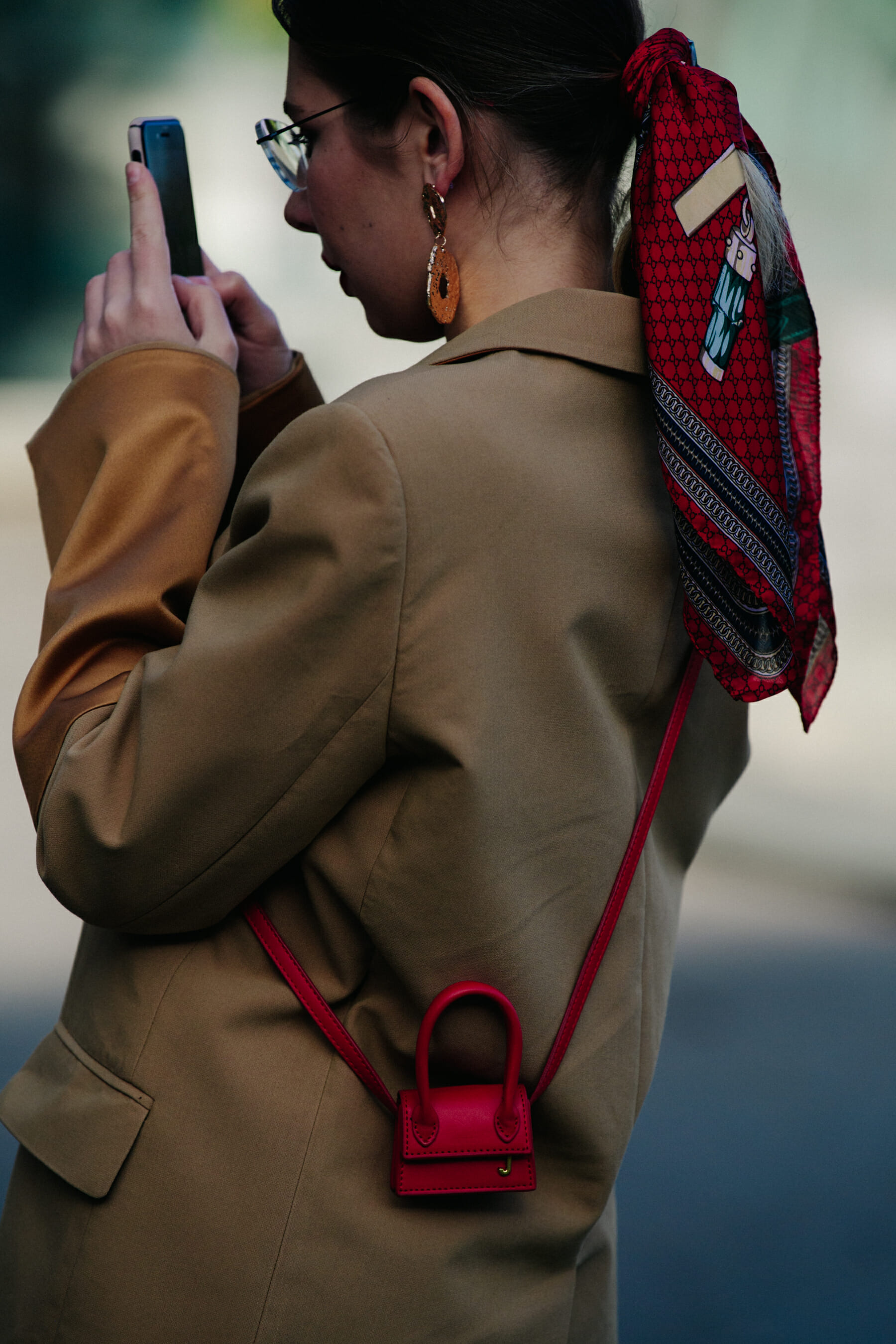 Woman carrying tiny Jacquemus bag