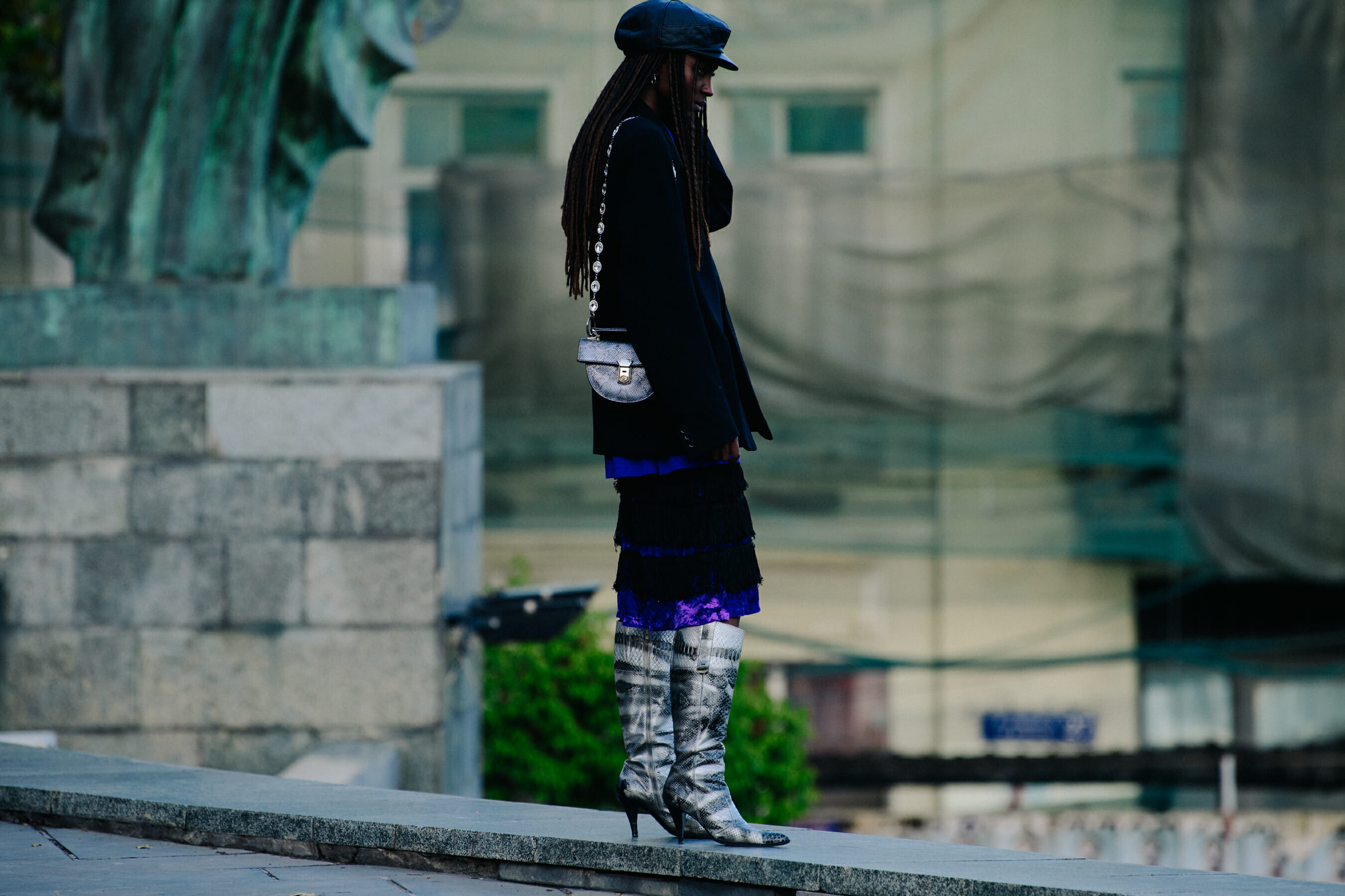 Model wearing dark outfit