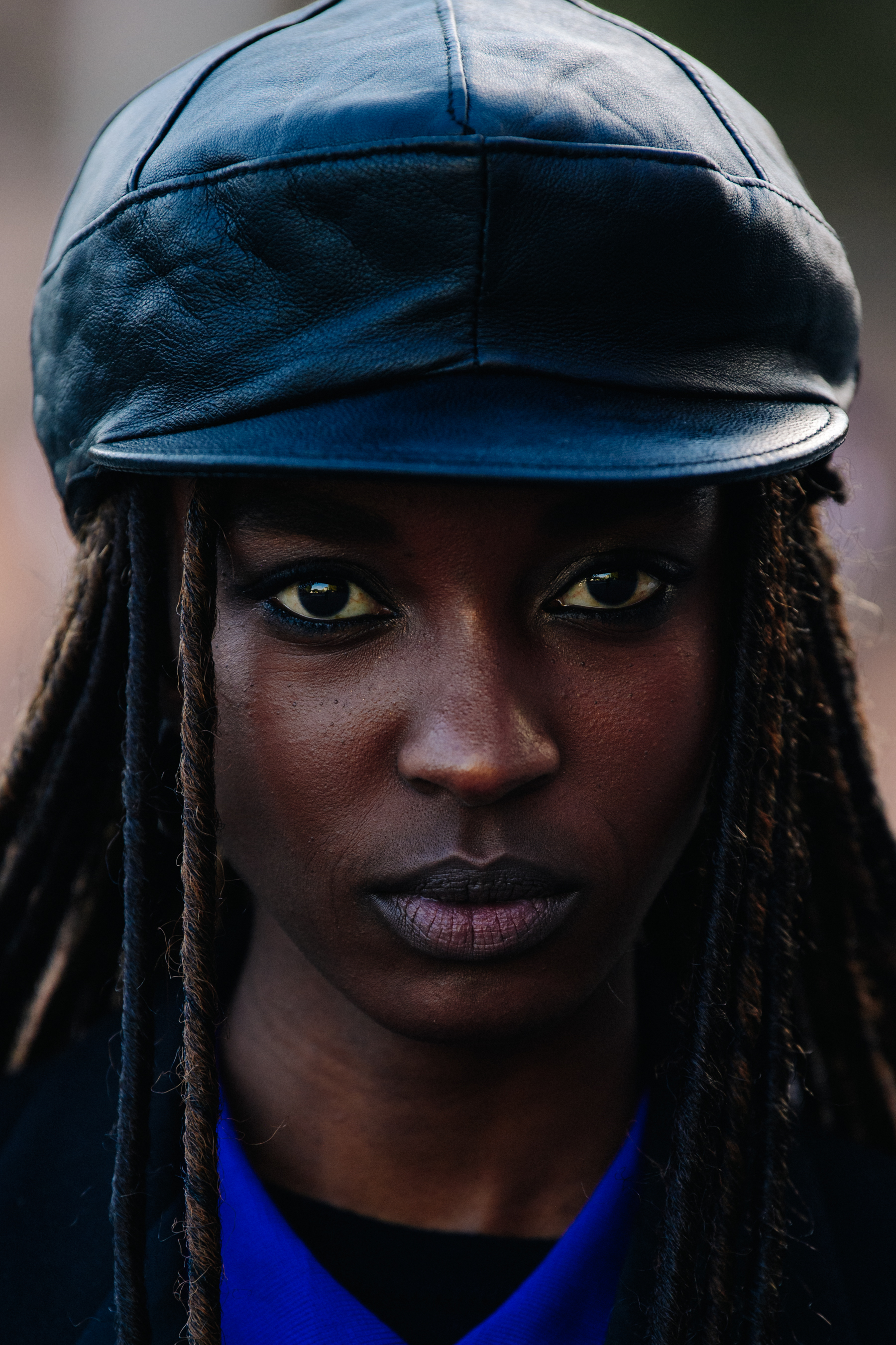 Model wearing black cap