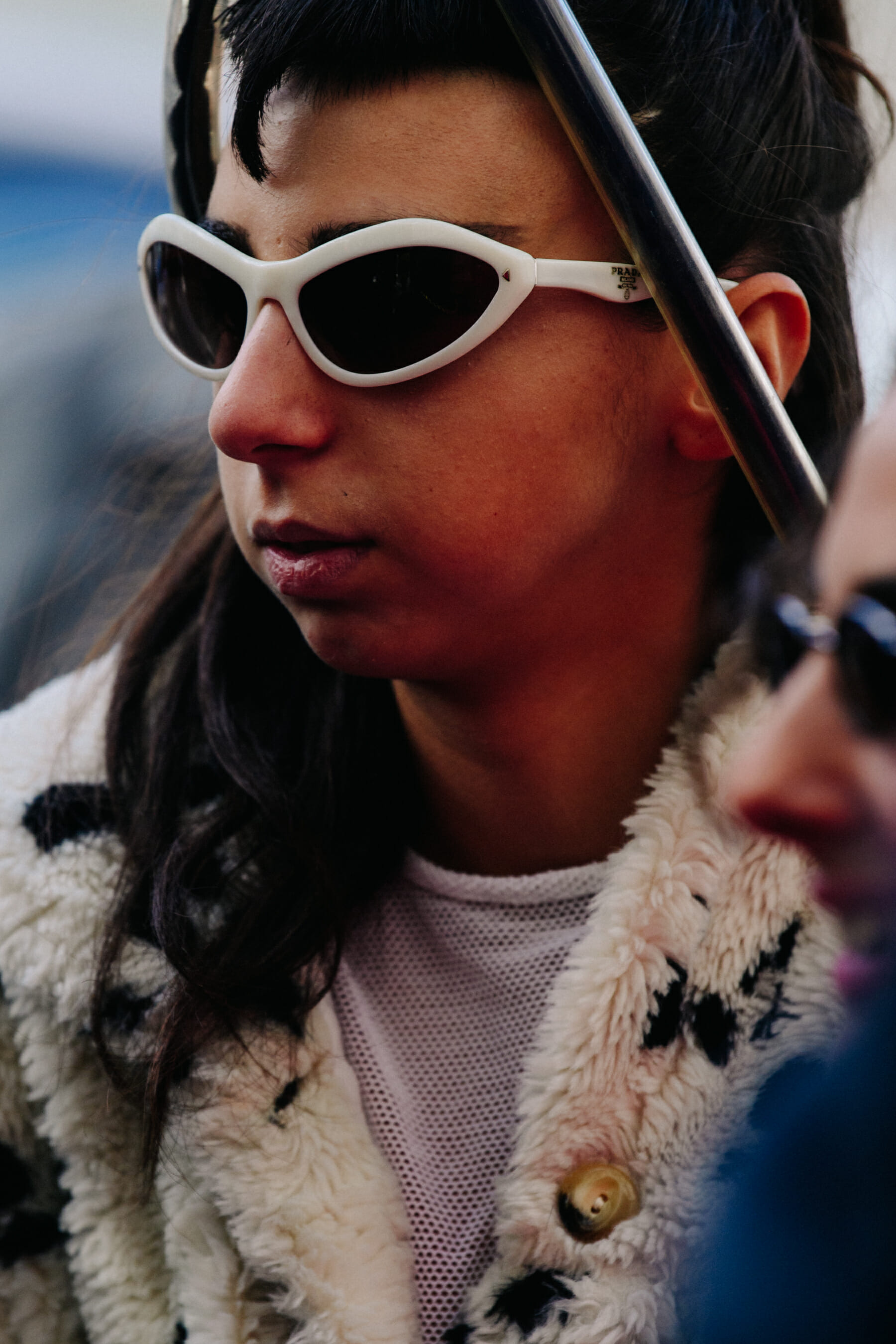 Woman wearing white sunglasses