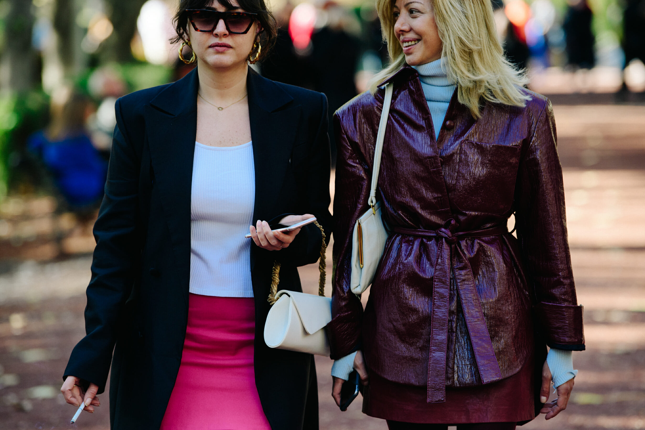 Two women wearing dark clothing