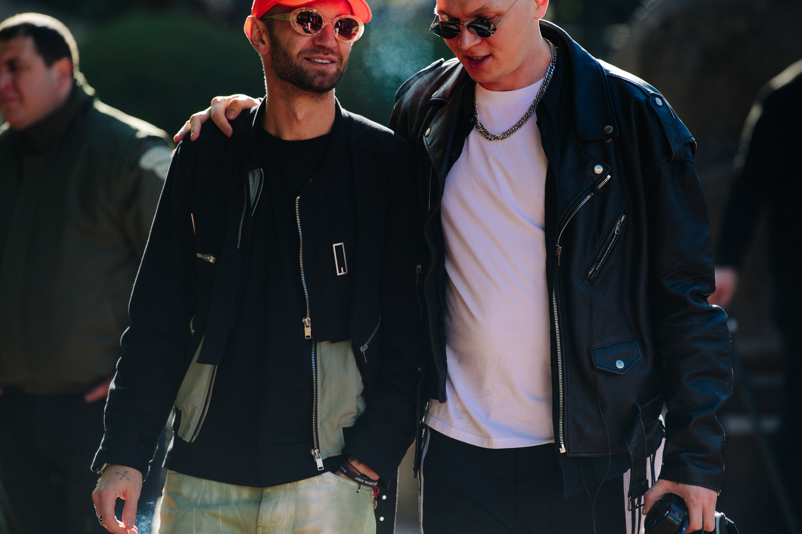 Two men wearing black jackets
