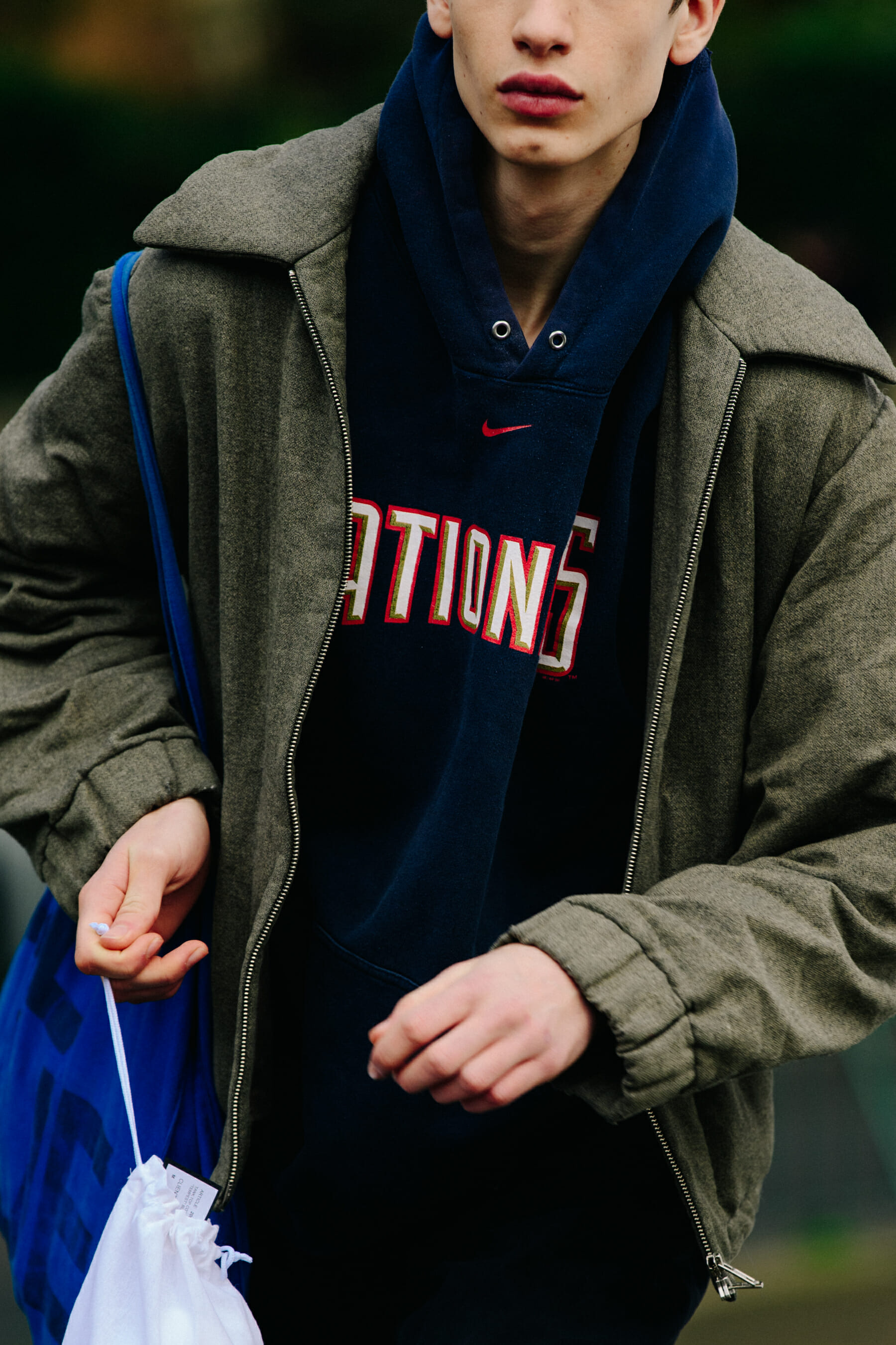 Model wearing blue Nike hoodie