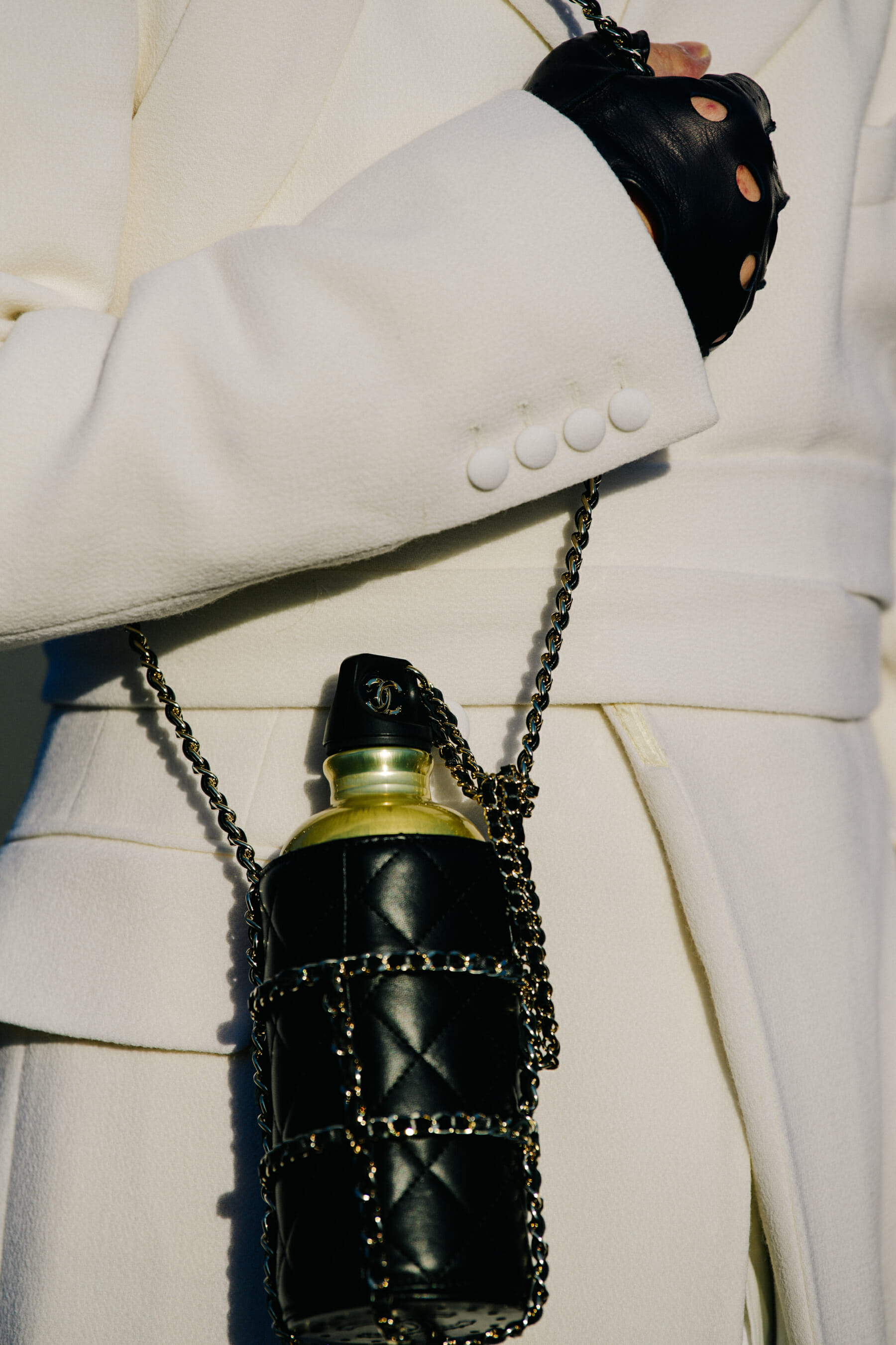 Carrying Chanel water bottle