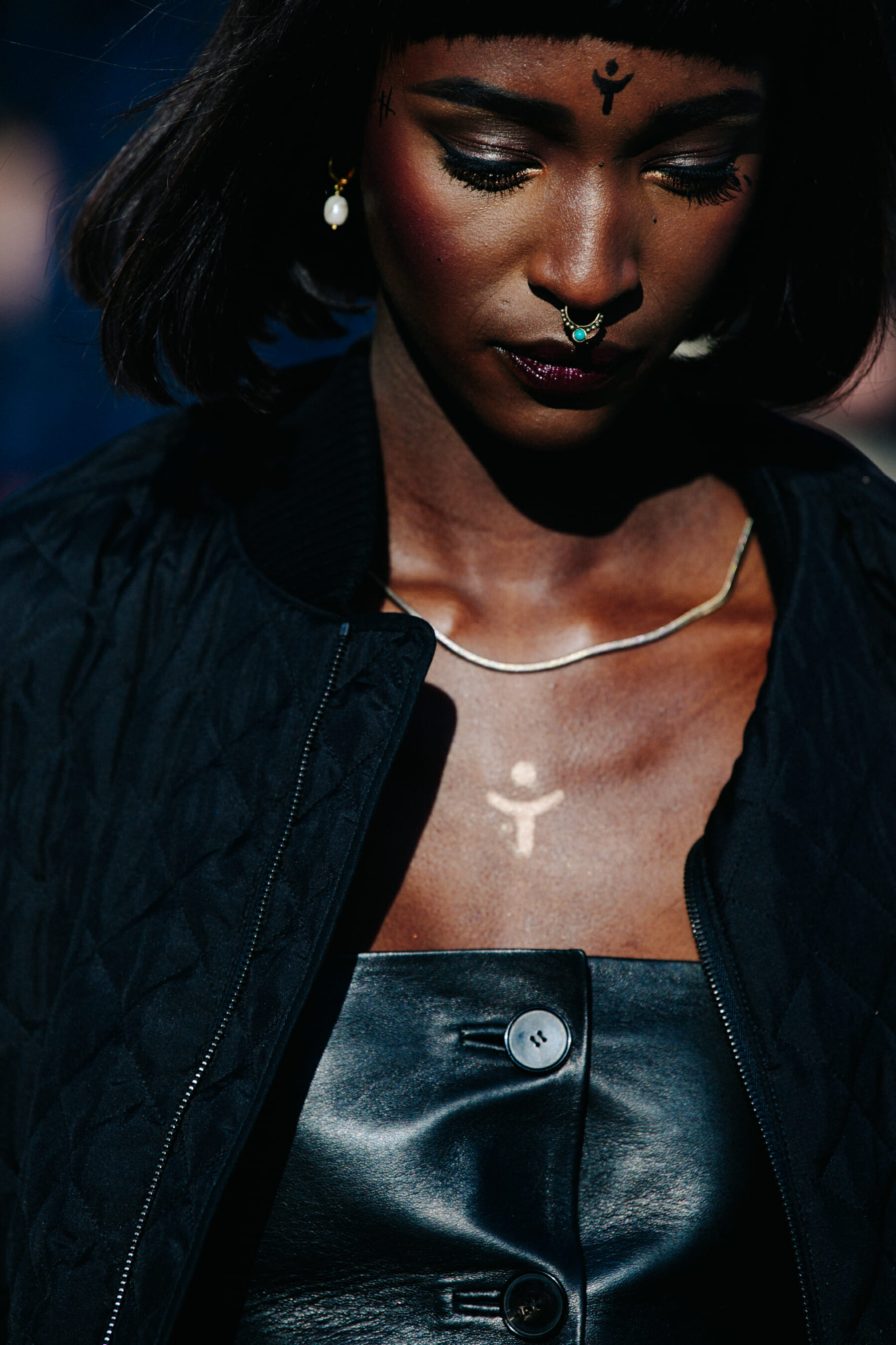 Woman wearing black leather top