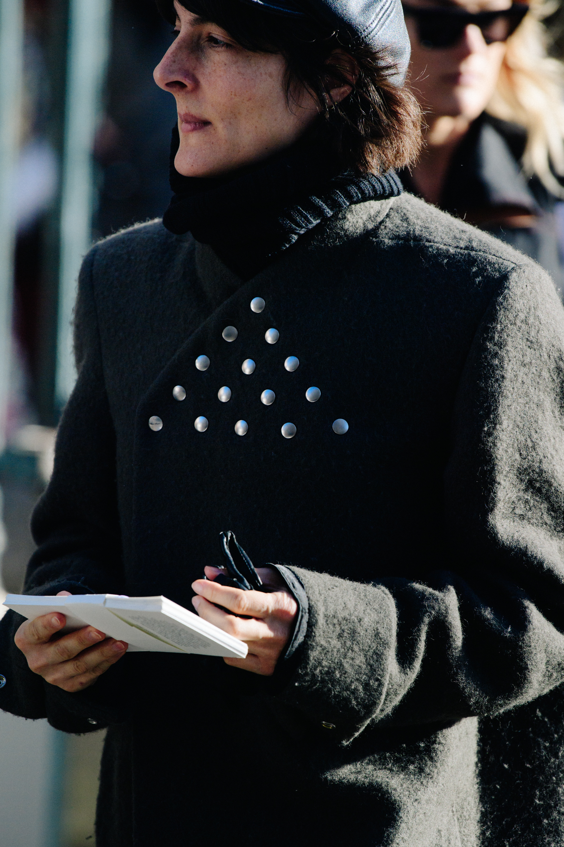 Woman wearing grey coat