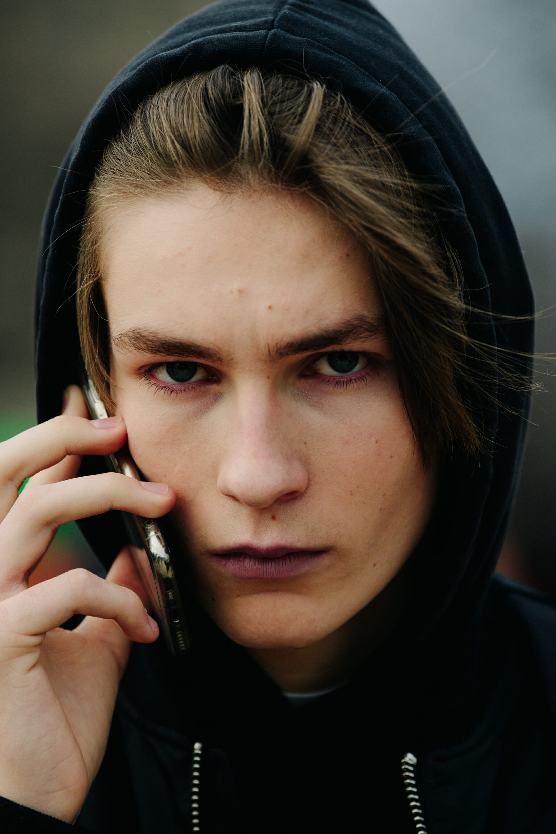Model wearing black hoodie