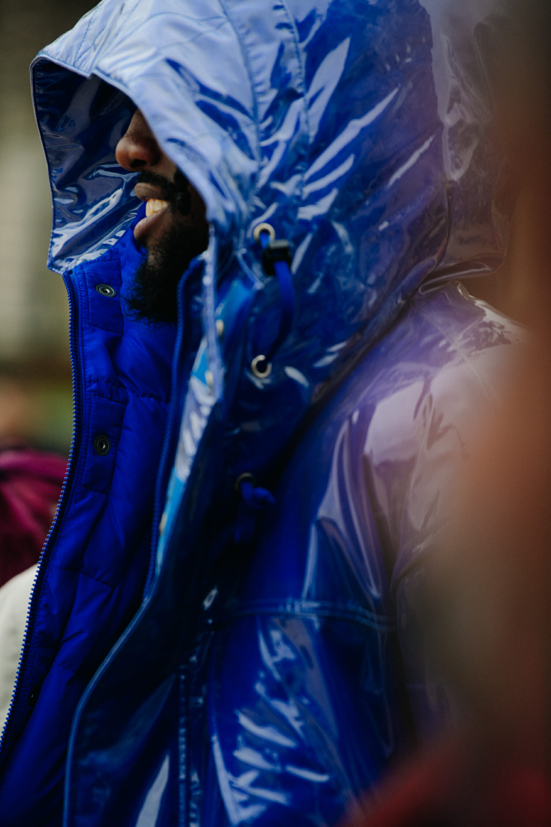 Man wearing blue hooded coat