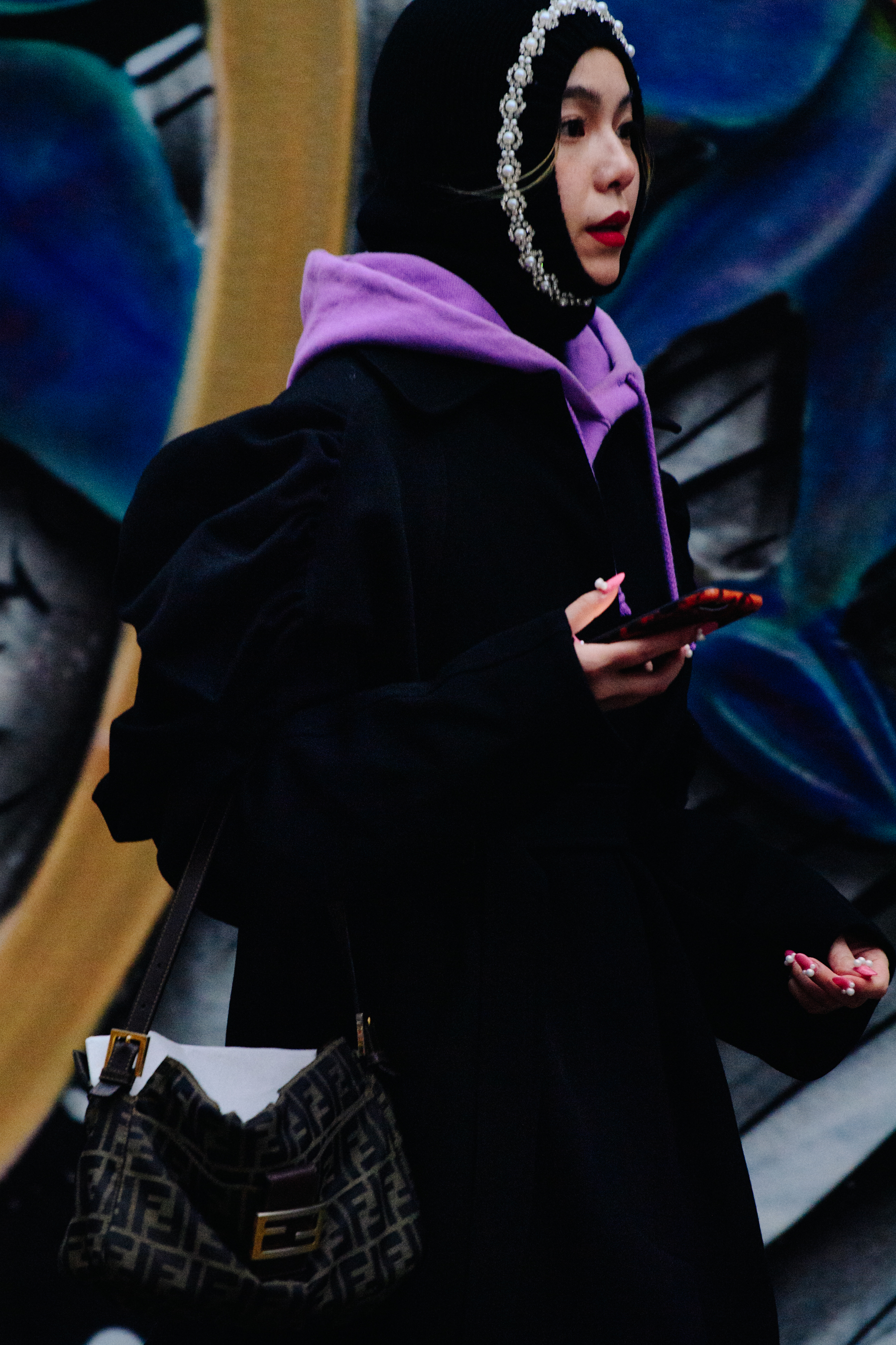 Woman wearing purple hoodie