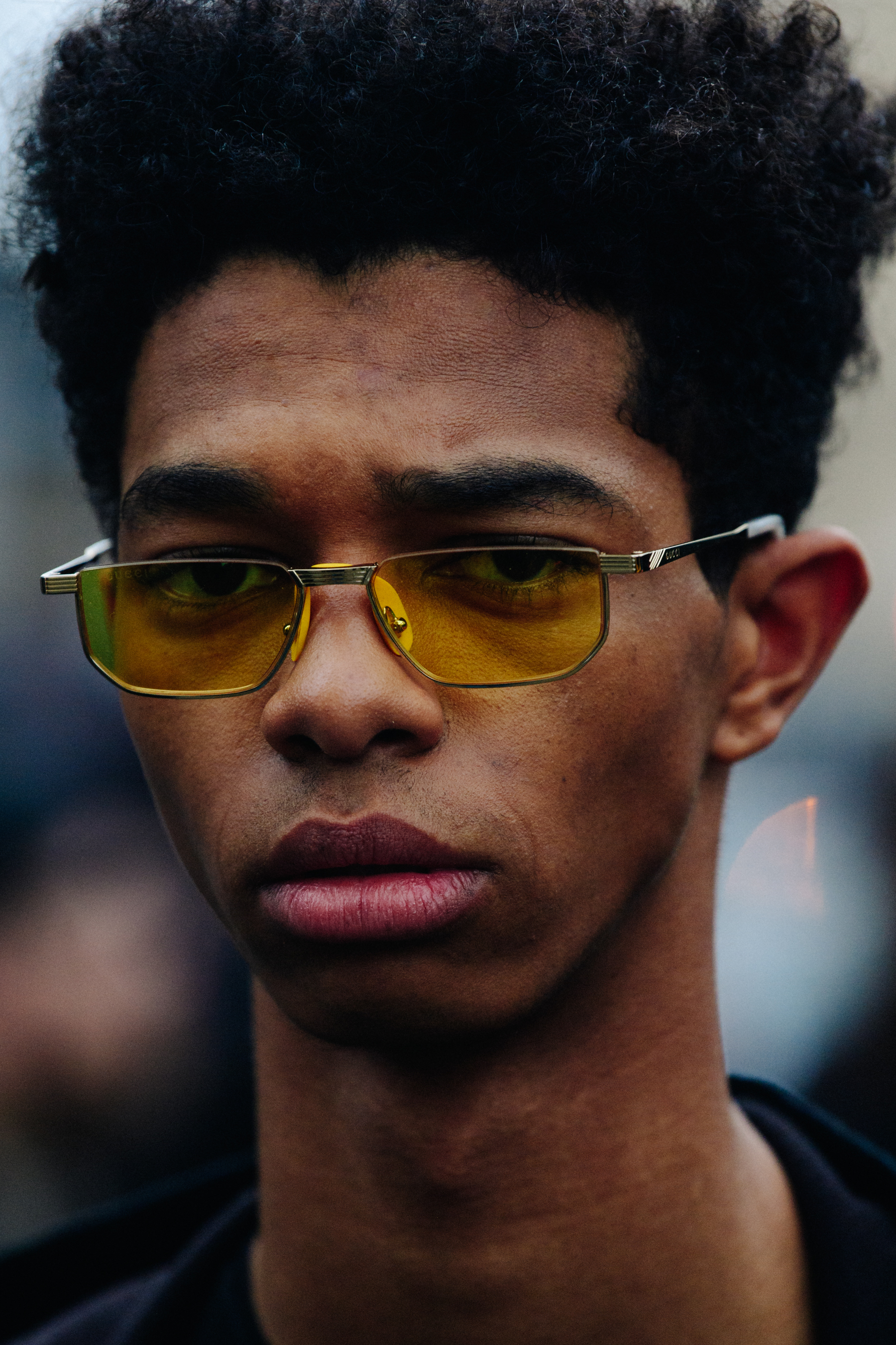 Model wearing yellow glasses