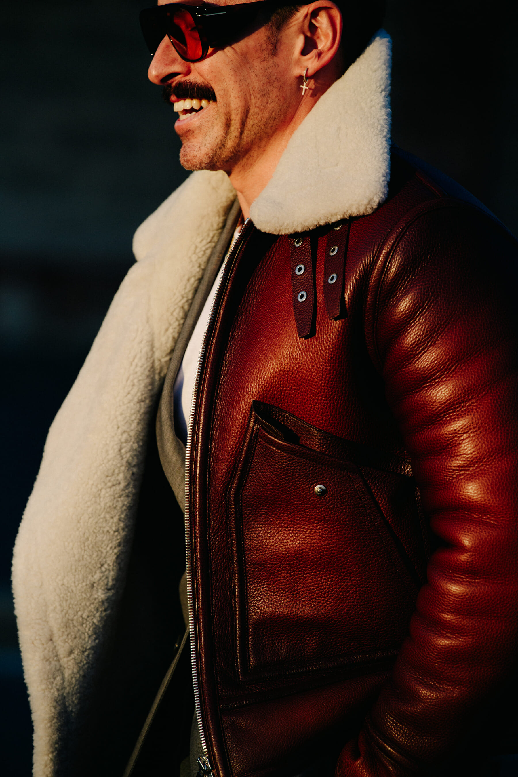 Man wearing red shearling jacket