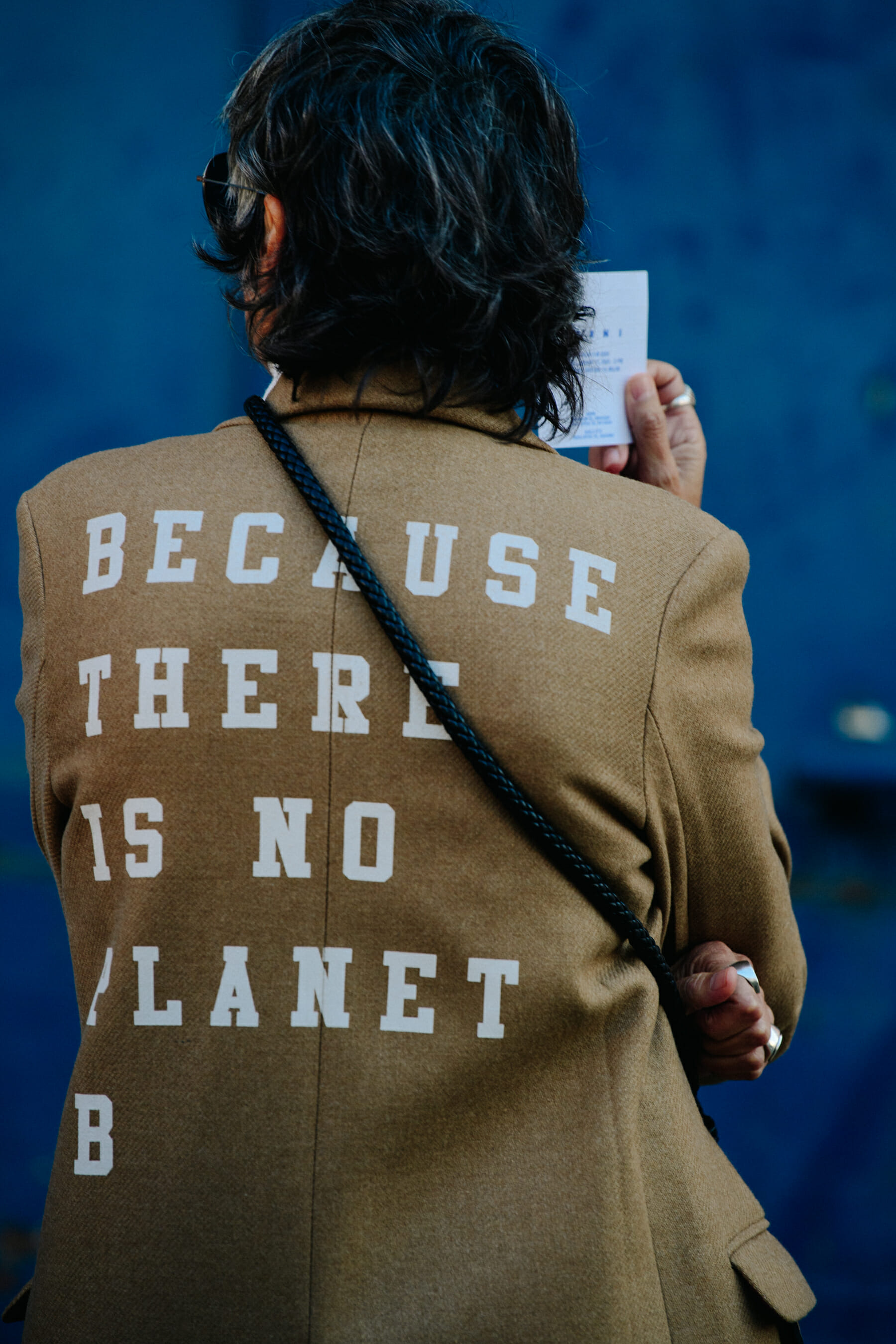 Woman wearing tan jacket