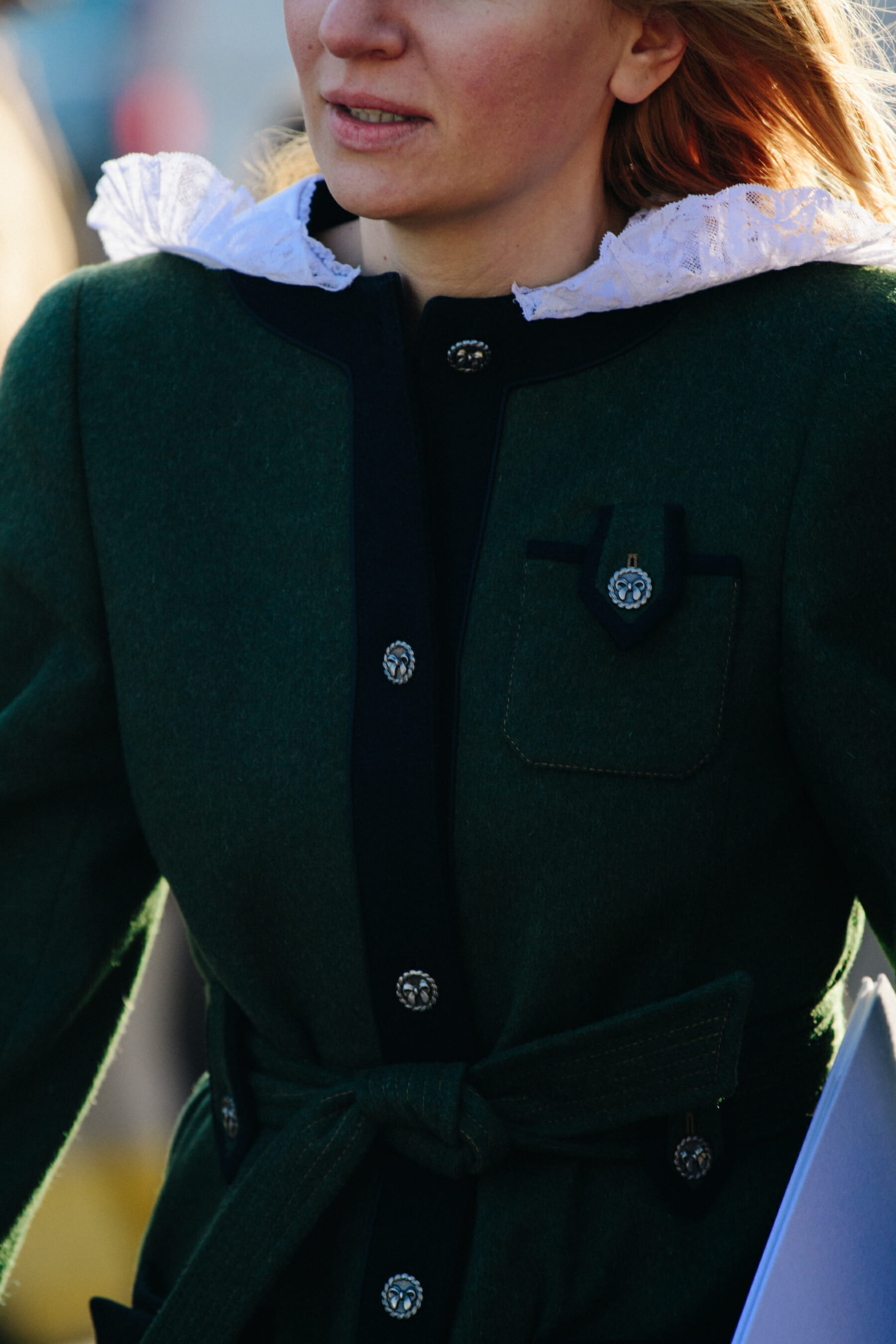 Woman wearing green wool jacket
