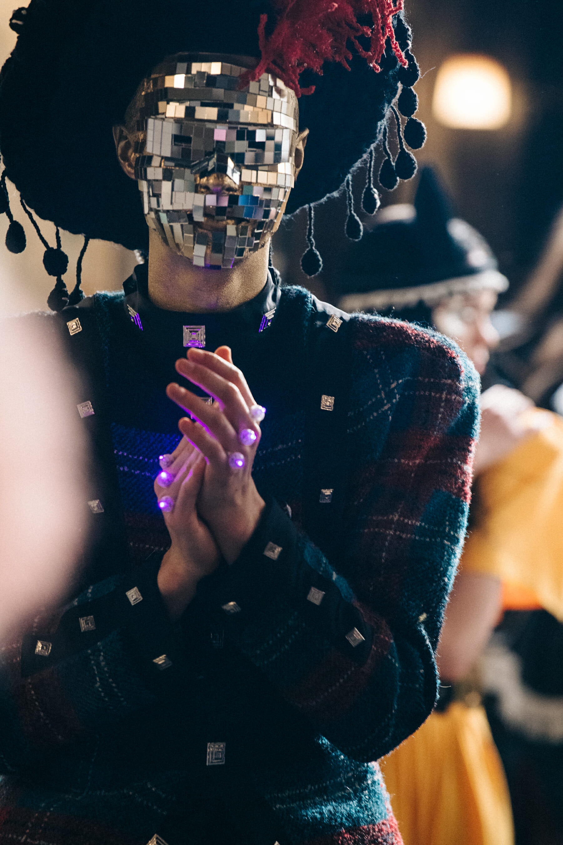 Models wearing colourful patterns backstage