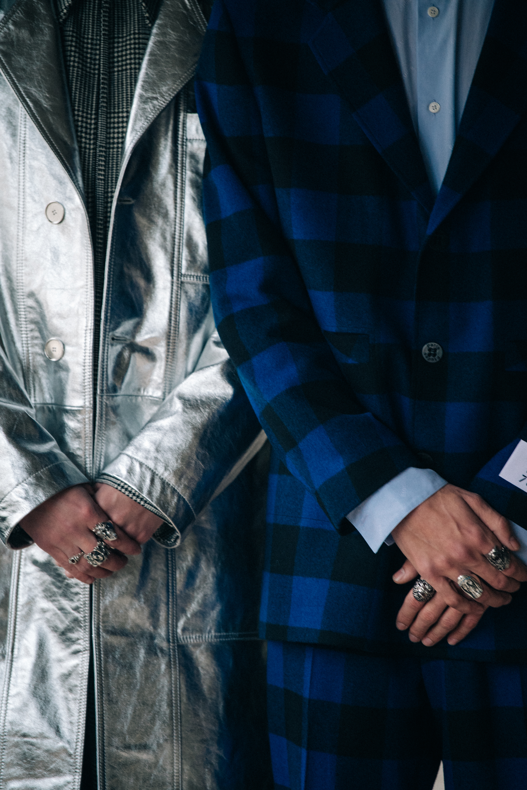 Models wearing grey outfits