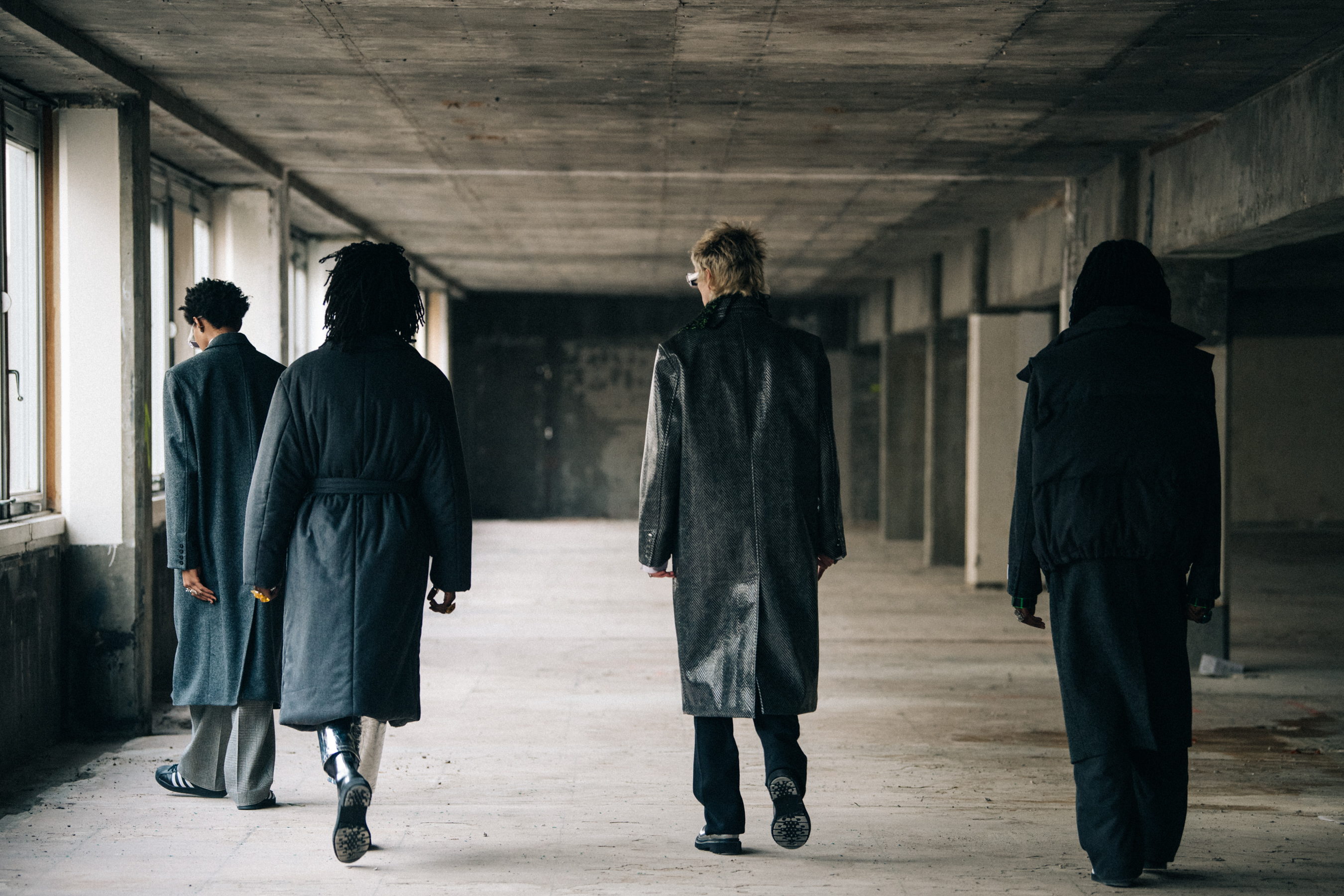 Models wearing dark outfits