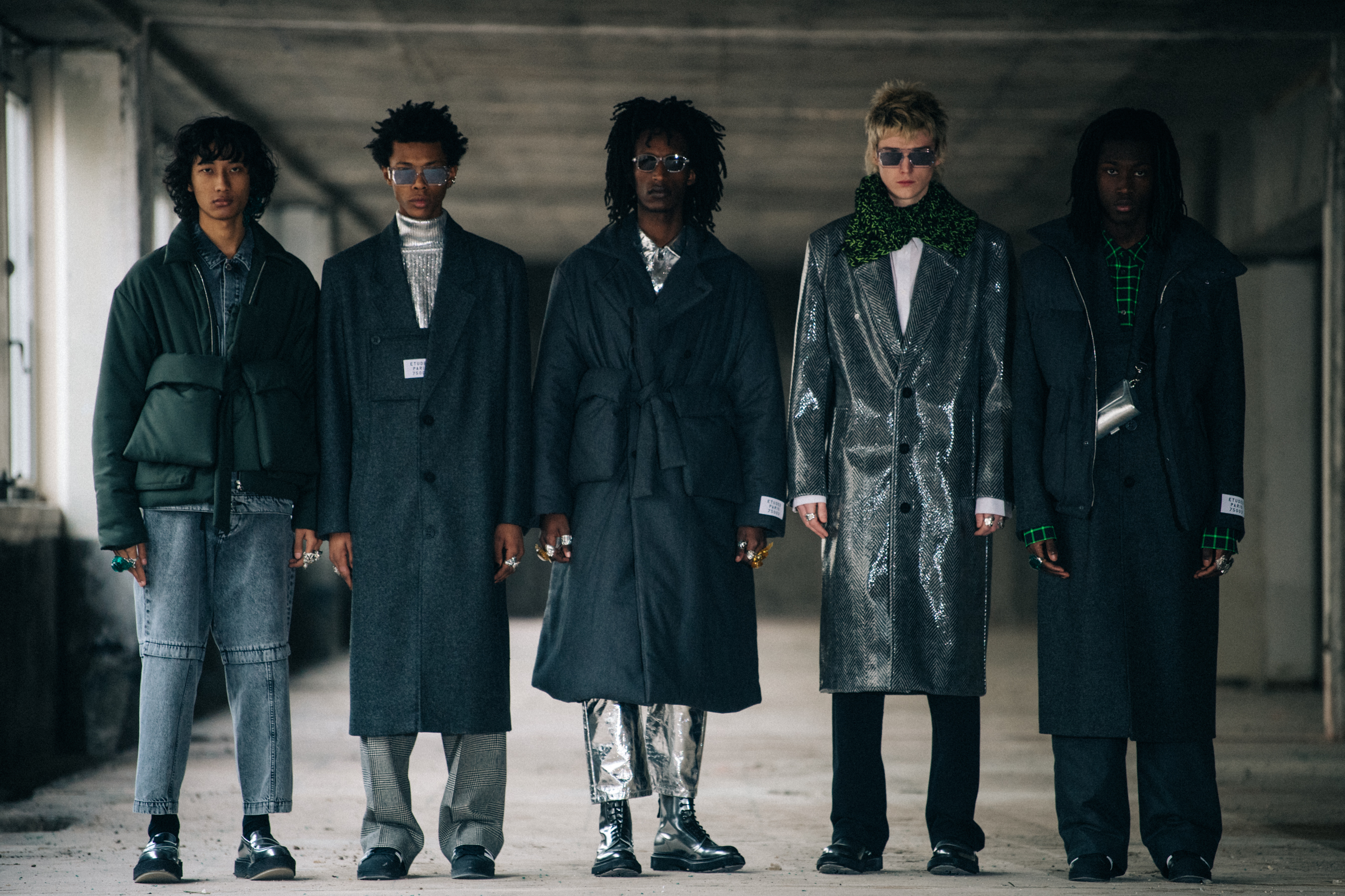 Models wearing grey outfits