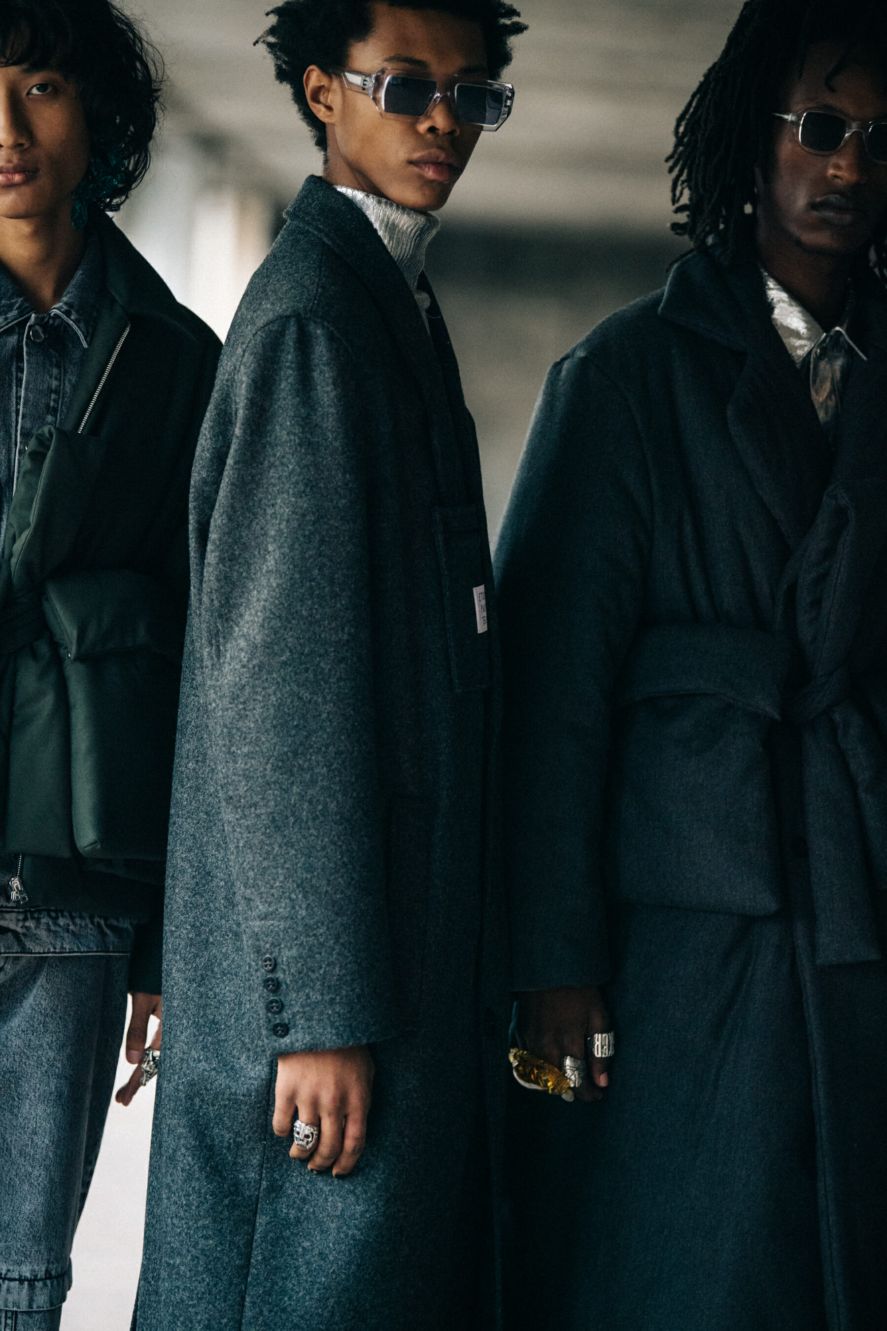 Models wearing grey outfits