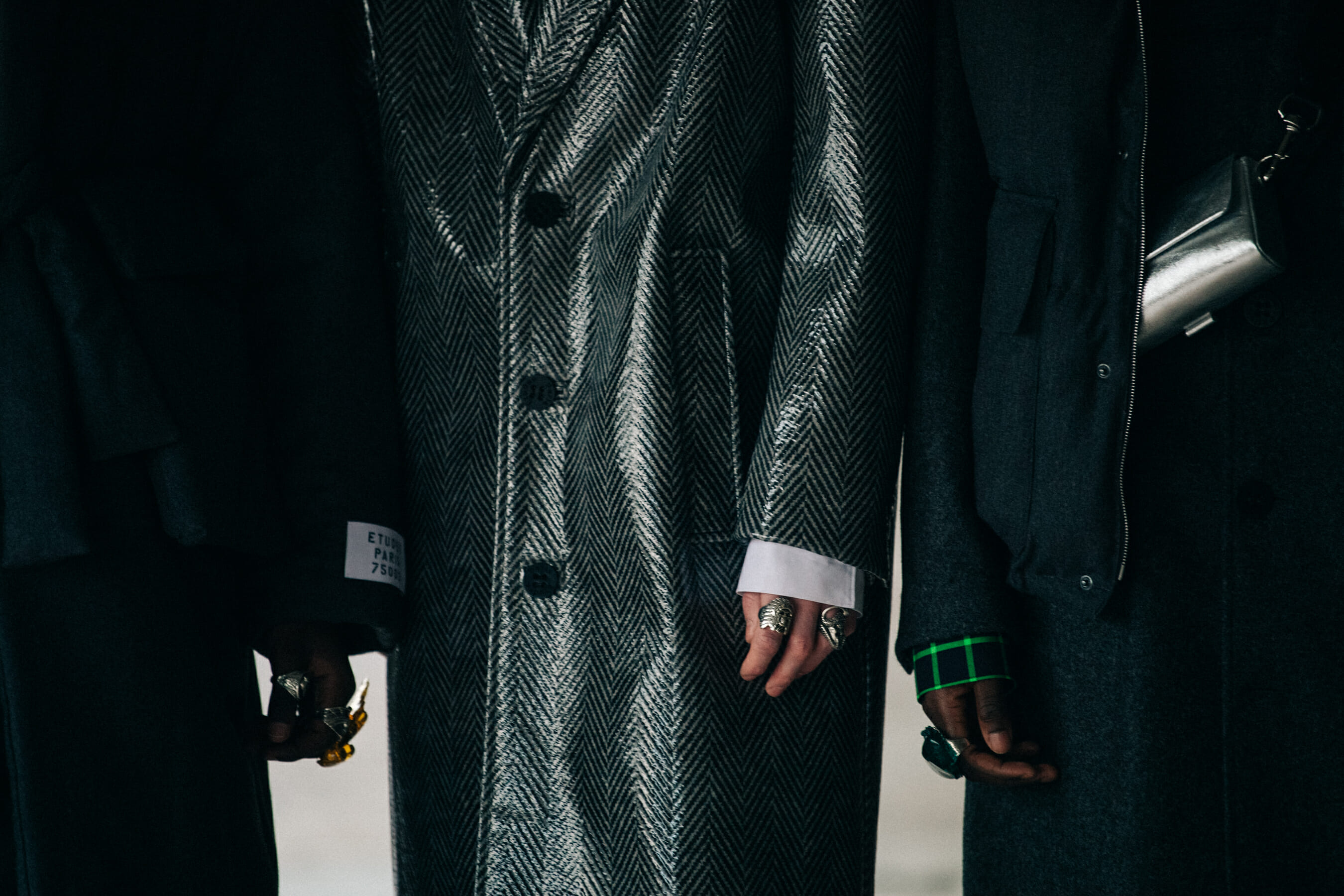 Models wearing grey outfits